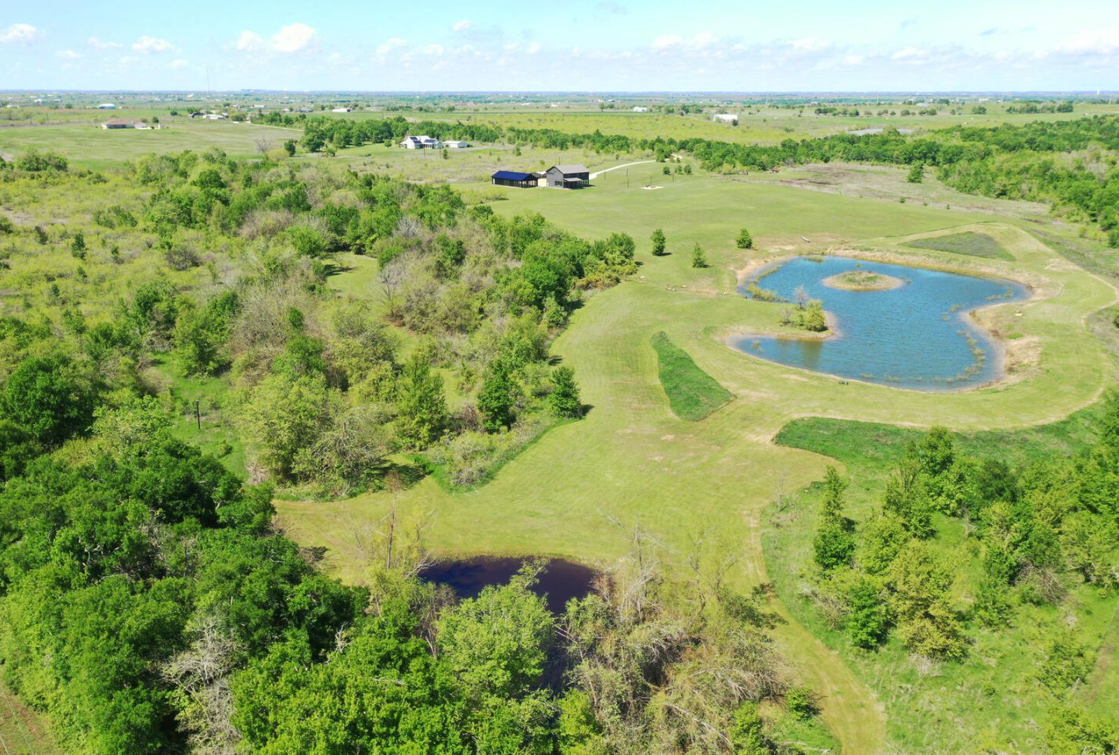0 County Road 463 Elgin, TX 78621 - Photo 4 of 37 a view of a lake with a beach
