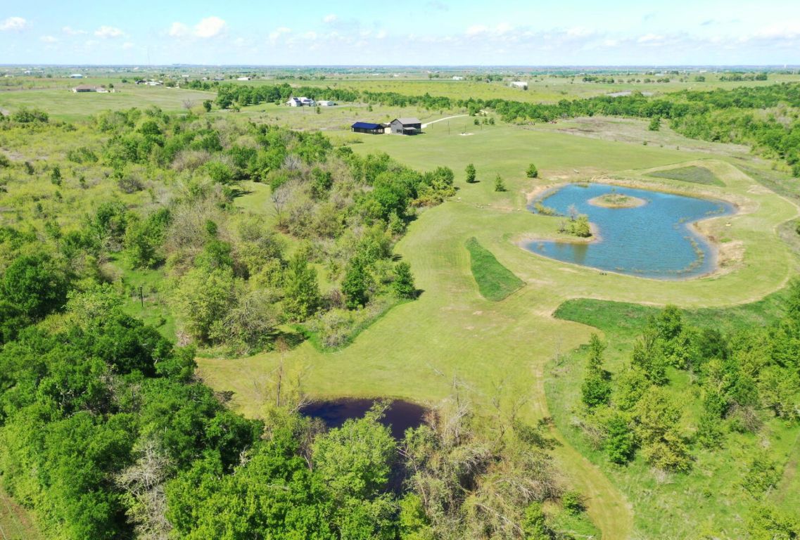 0 County Road 463 Elgin, TX 78621 - Photo 4 of 37 a view of a lake with a beach