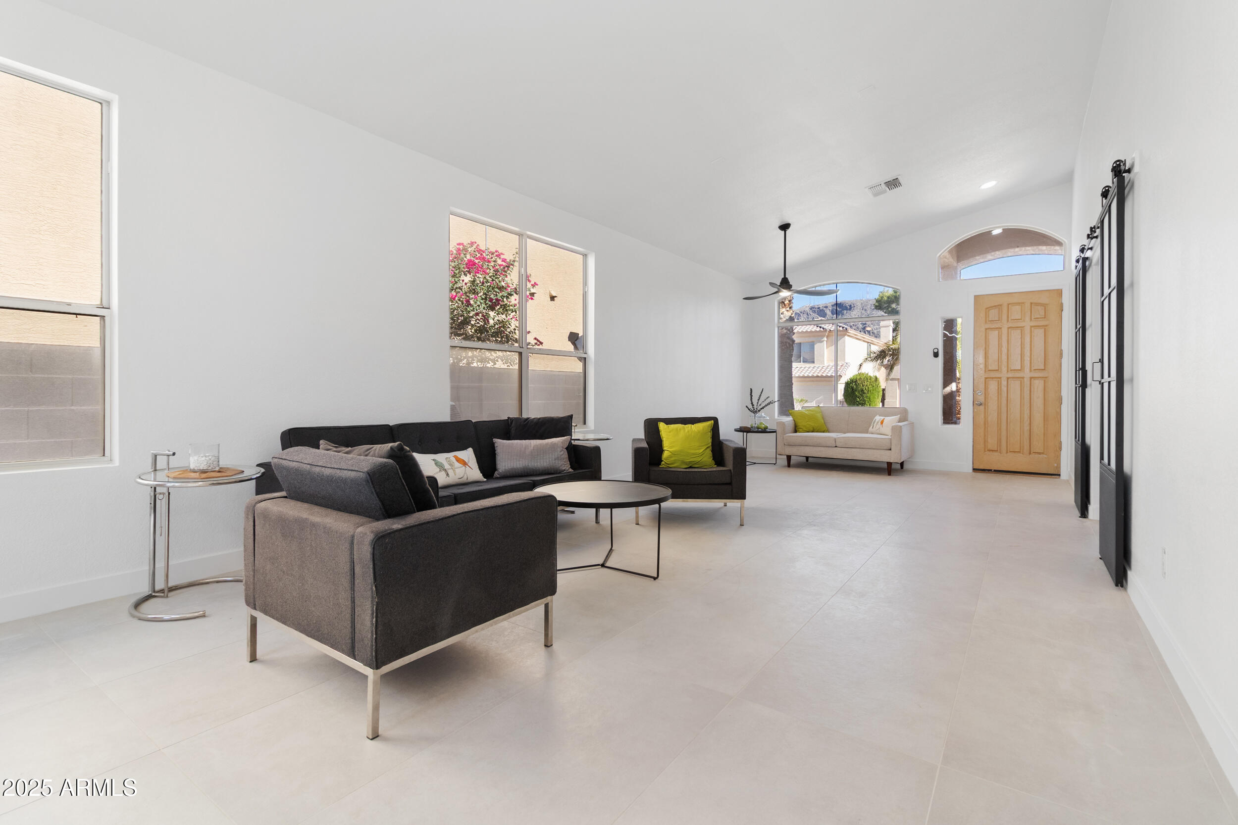 1349 East Sapium Way Phoenix, AZ 85048 - Photo 28 of 33 a living room with furniture and a flat screen tv