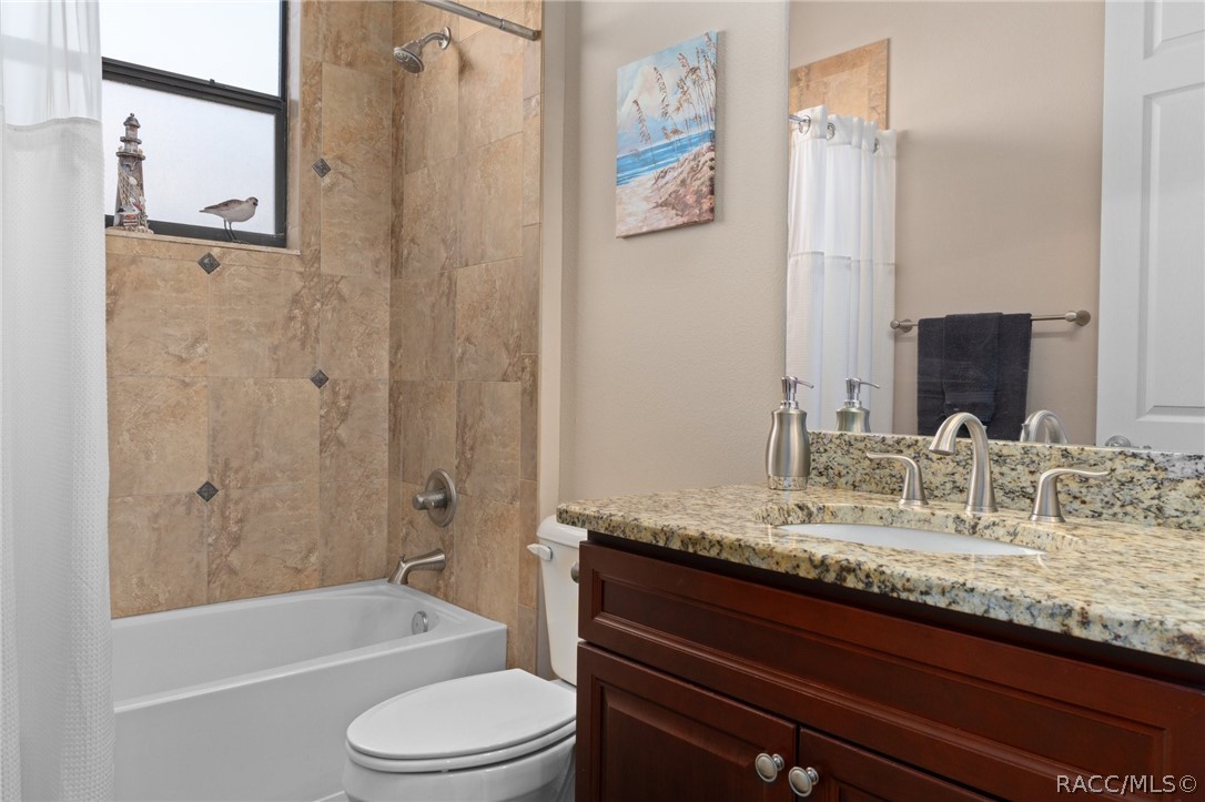 2015 North Rhodes Point Hernando, FL 34442 - Photo 28 of 82 Guest Bathroom decor ties in with the rest of the home and features comfort height vanity with a granite top.