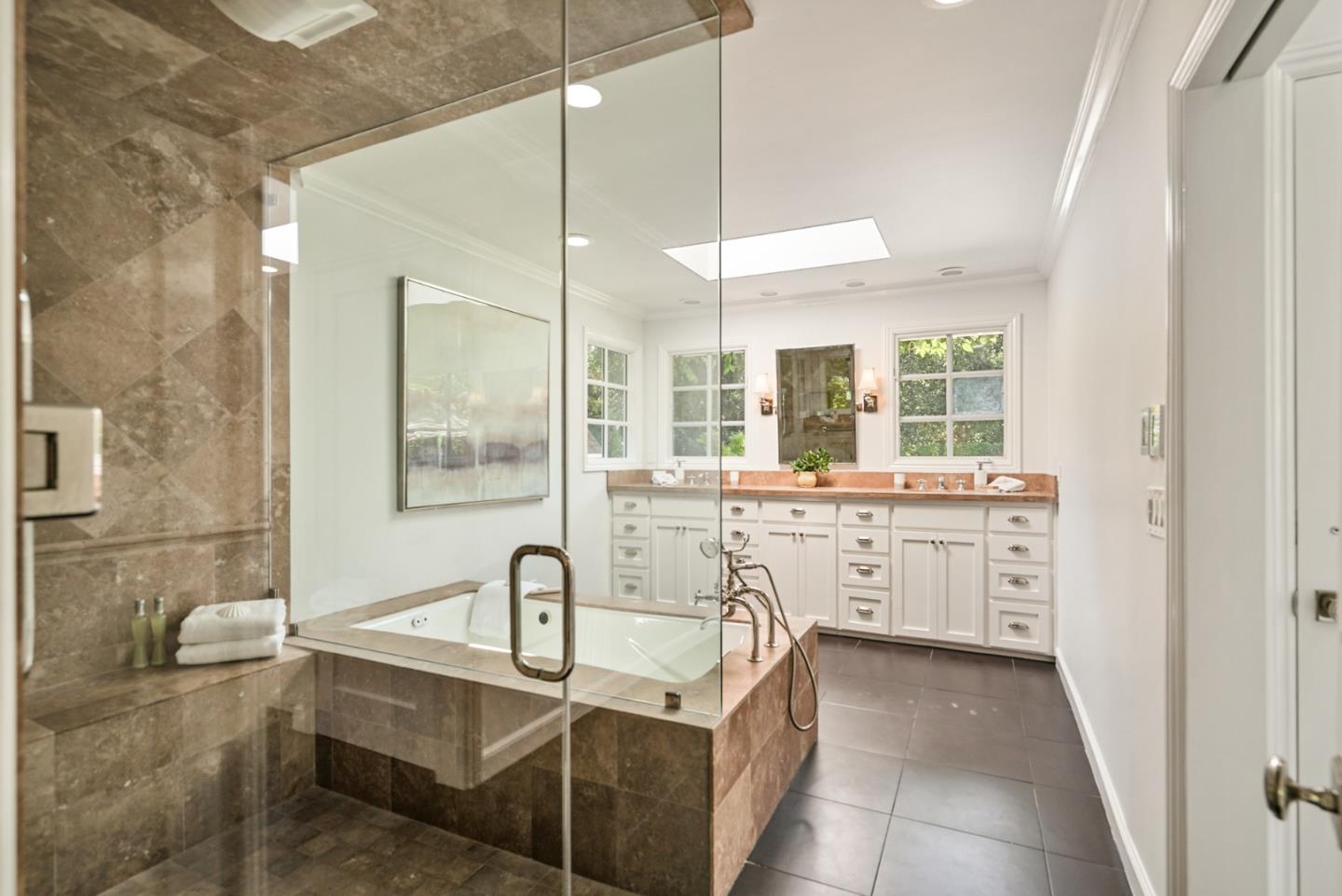 76 Catalpa Drive Atherton, CA 94027 - Photo 22 of 52 a large bathroom with a double vanity sink a mirror and a bathtub