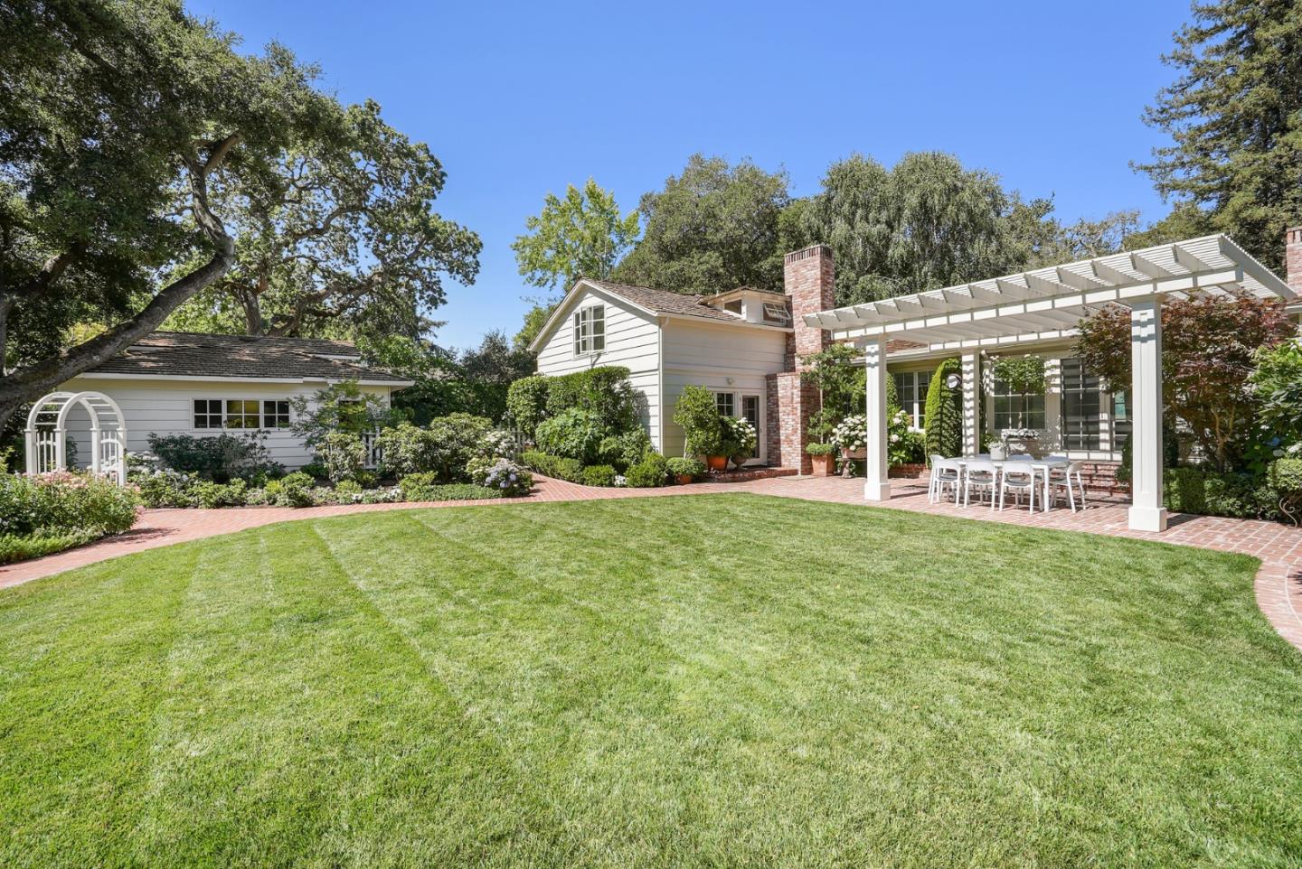 76 Catalpa Drive Atherton, CA 94027 - Photo 33 of 52 a front view of a house with a yard and green space