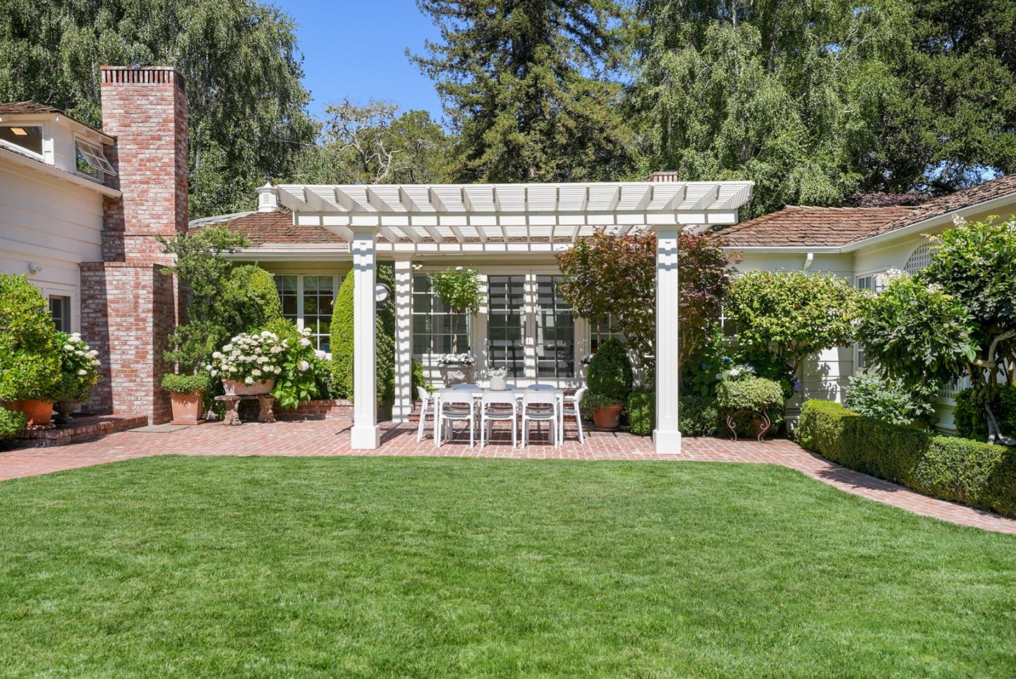 76 Catalpa Drive Atherton, CA 94027 - Photo 34 of 52 a view of a chair and table in the garden