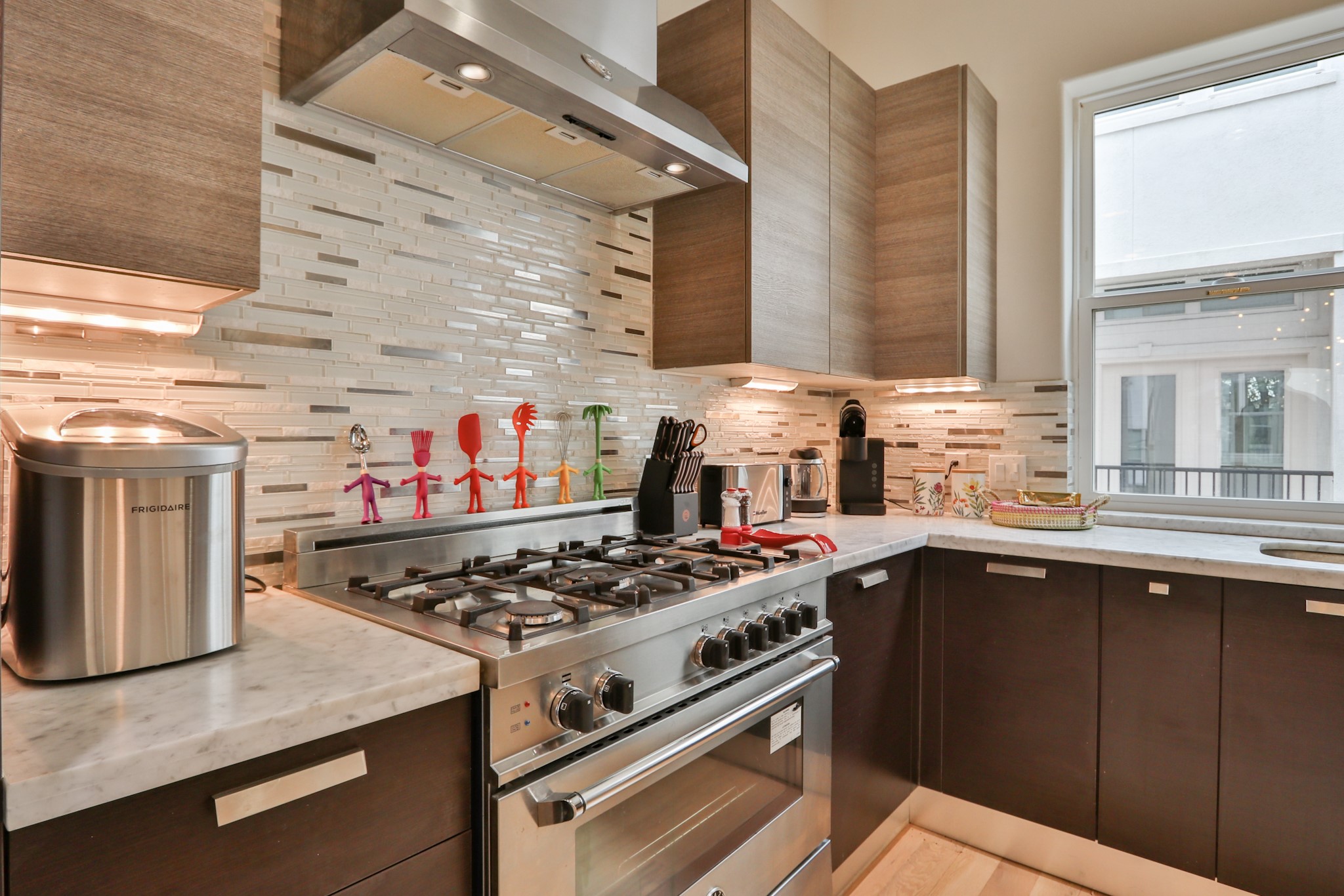 4114 Driscoll Street Houston, TX 77098 - Photo 16 of 50 a kitchen with a stove and a sink