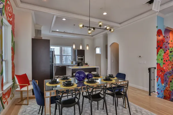 a view of a dining room with furniture and wooden floor