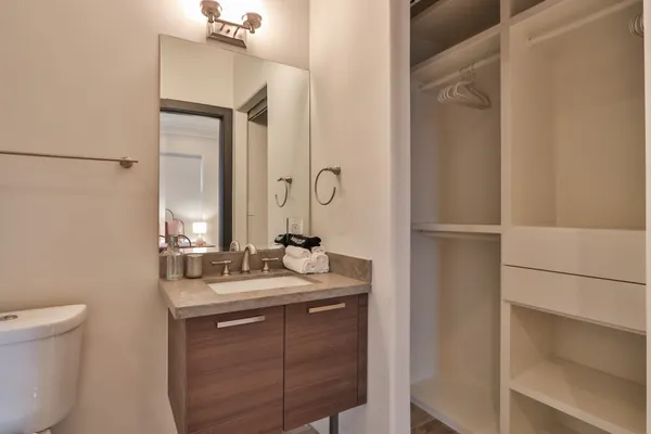 a bathroom with a double vanity sink and a mirror