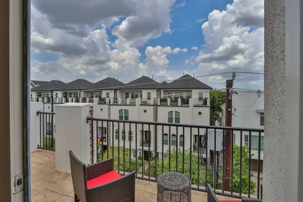 a view of a houses with a balcony