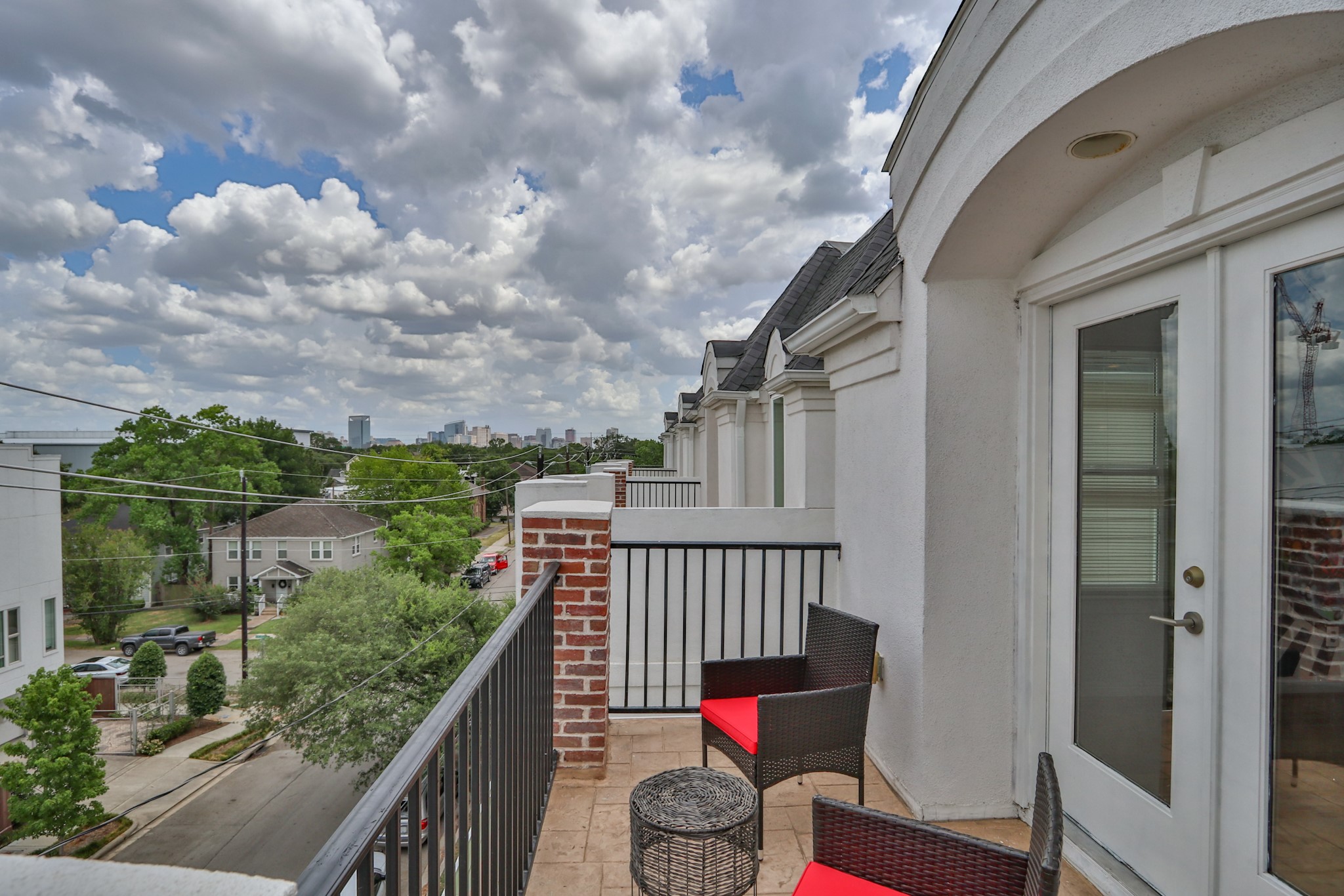 4114 Driscoll Street Houston, TX 77098 - Photo 44 of 50 a balcony with wooden floor and outdoor seating