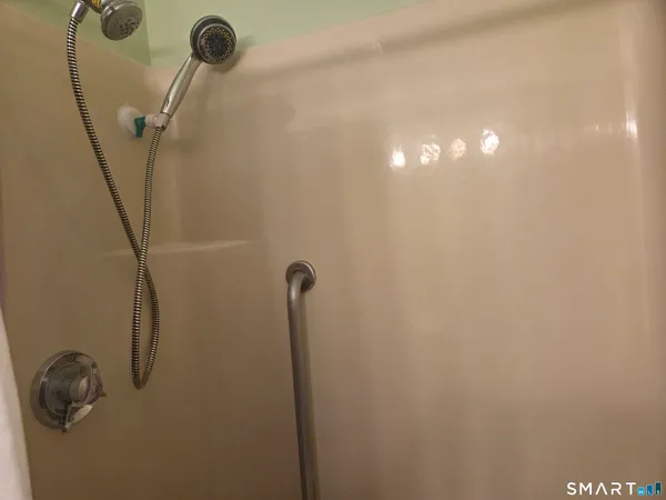 a room with a refrigerator and washer