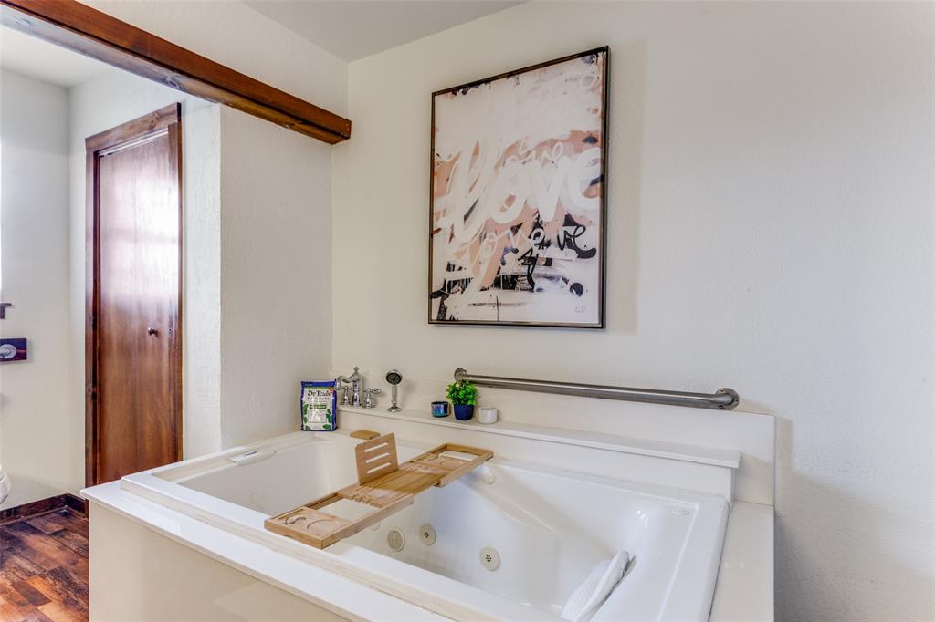 950 Johnson Bend Road Weatherford, TX 76088 - Photo 20 of 40 a bathroom with a sink and a mirror