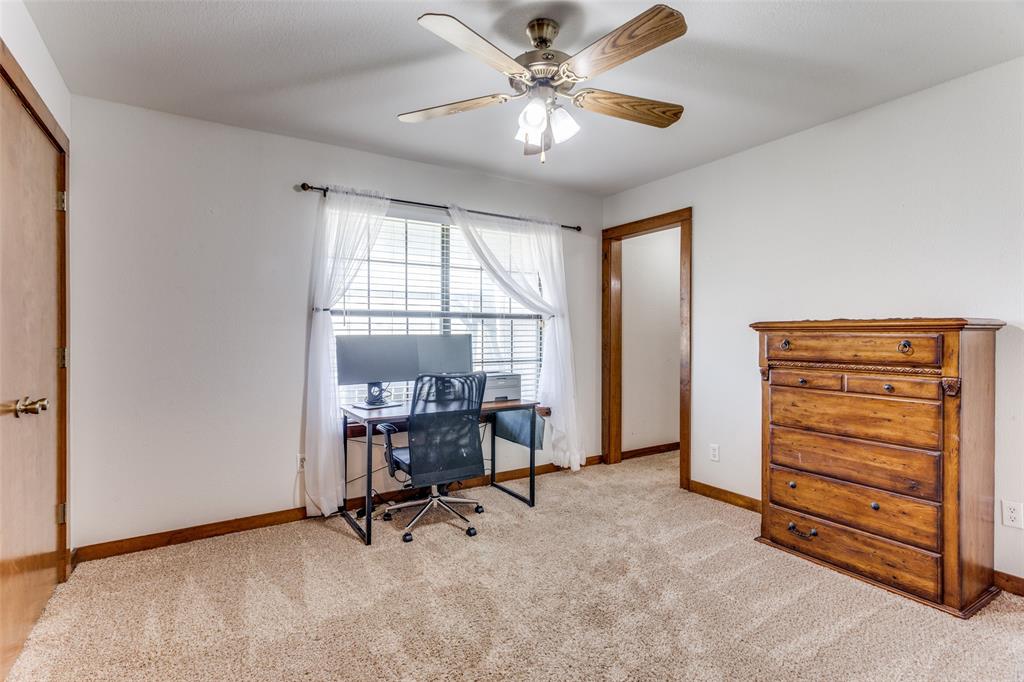 950 Johnson Bend Road Weatherford, TX 76088 - Photo 21 of 40 a view of a workspace with furniture and a window