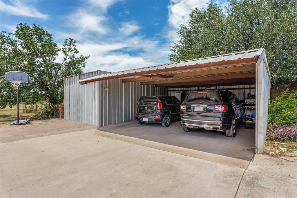 950 Johnson Bend Road Weatherford, TX 76088 - Photo 32 of 40 a car parked in front of house