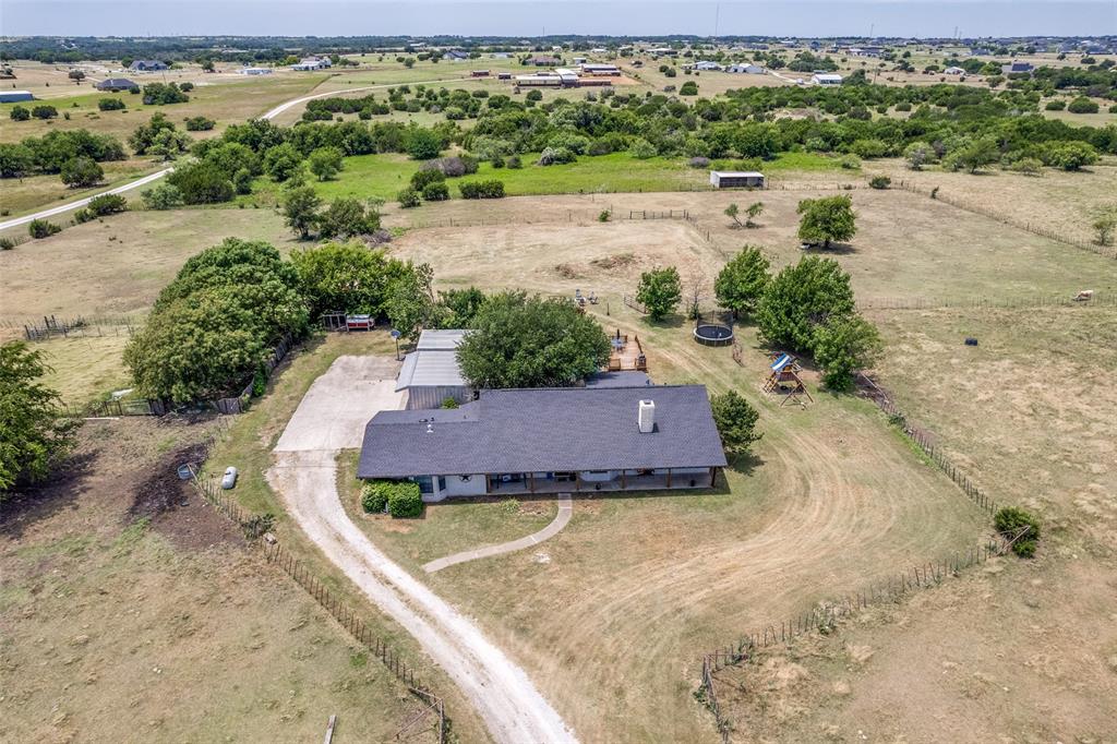 950 Johnson Bend Road Weatherford, TX 76088 - Photo 38 of 40 an aerial view of a house with a yard