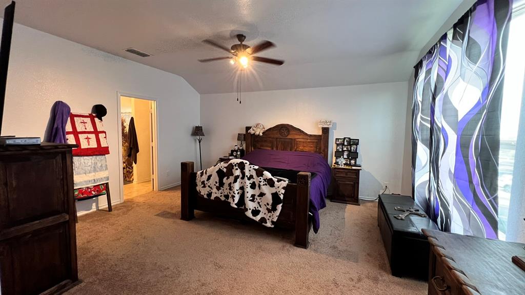 324 Fairgrounds Lane Ponder, TX 76259 - Photo 35 of 40 a bedroom with furniture and a mirror