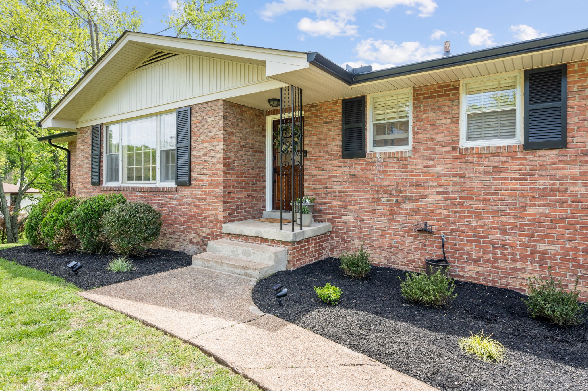 705 Vanoke Drive Madison, TN 37115 - Photo 2 of 40 a front view of a house with garden