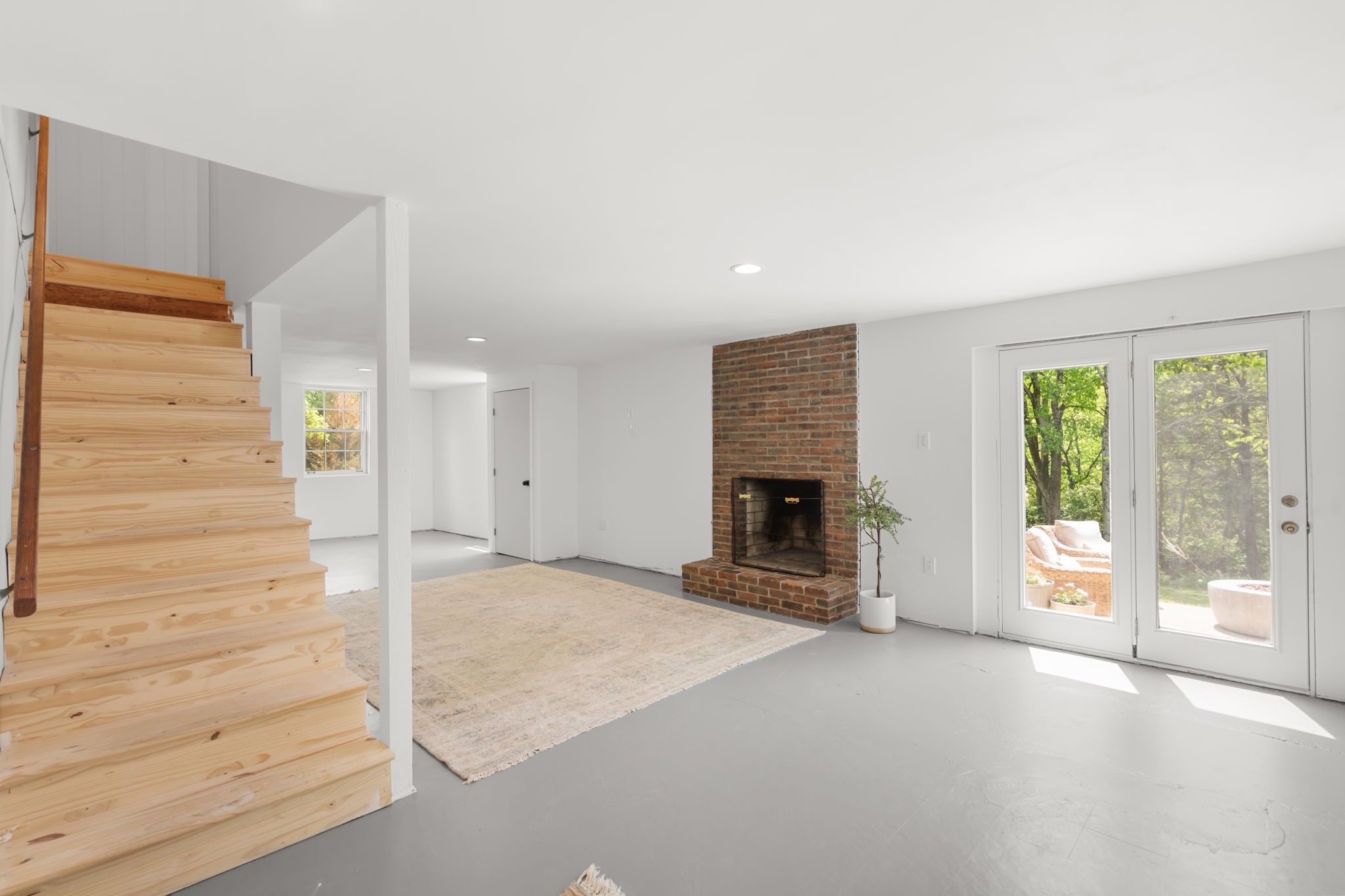 705 Vanoke Drive Madison, TN 37115 - Photo 22 of 40 an empty room with floor to ceiling window and fireplace