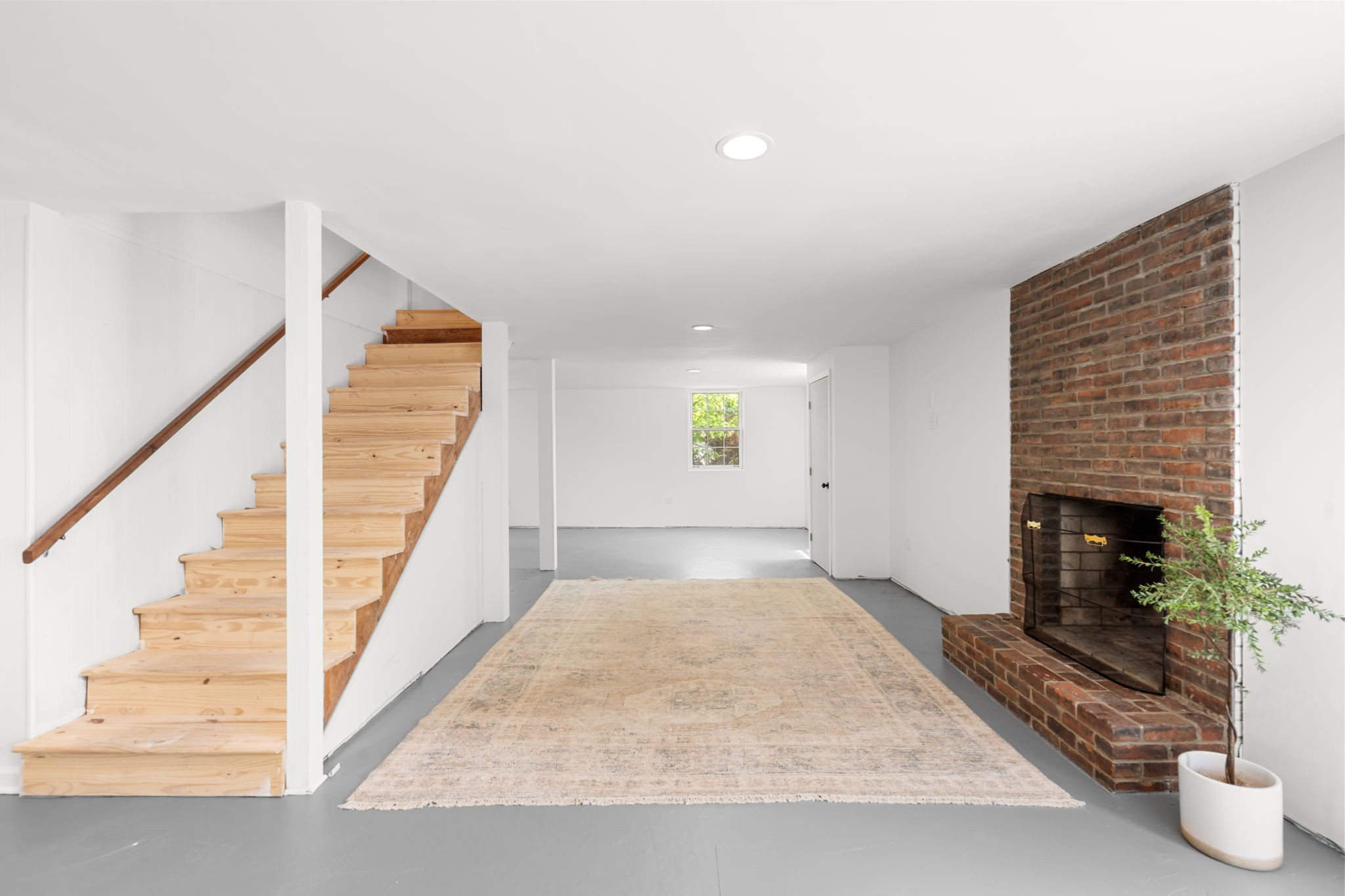705 Vanoke Drive Madison, TN 37115 - Photo 23 of 40 a view of an empty room with wooden floor and a fireplace