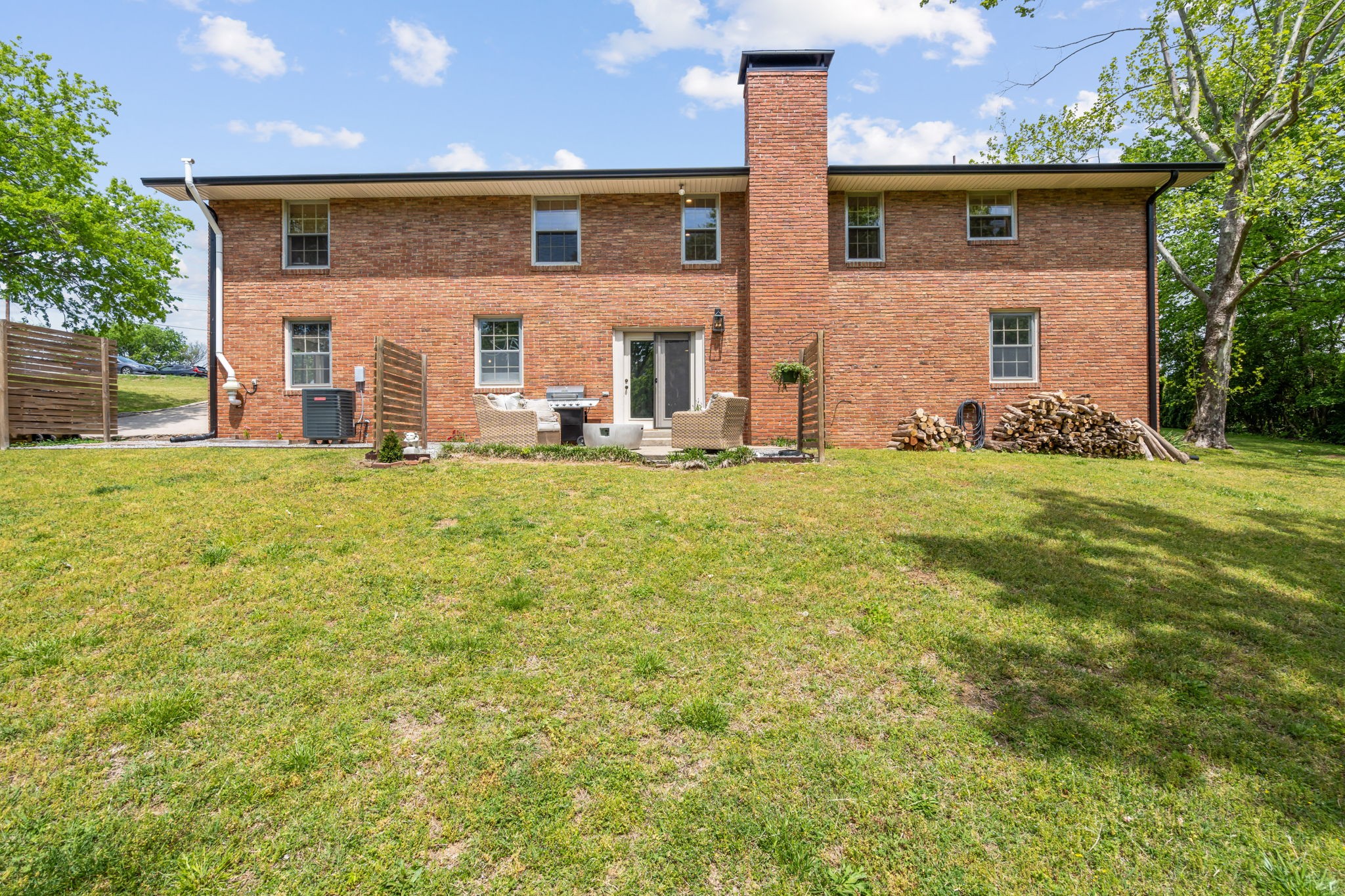 705 Vanoke Drive Madison, TN 37115 - Photo 28 of 40 a front view of house with yard and trees in the background