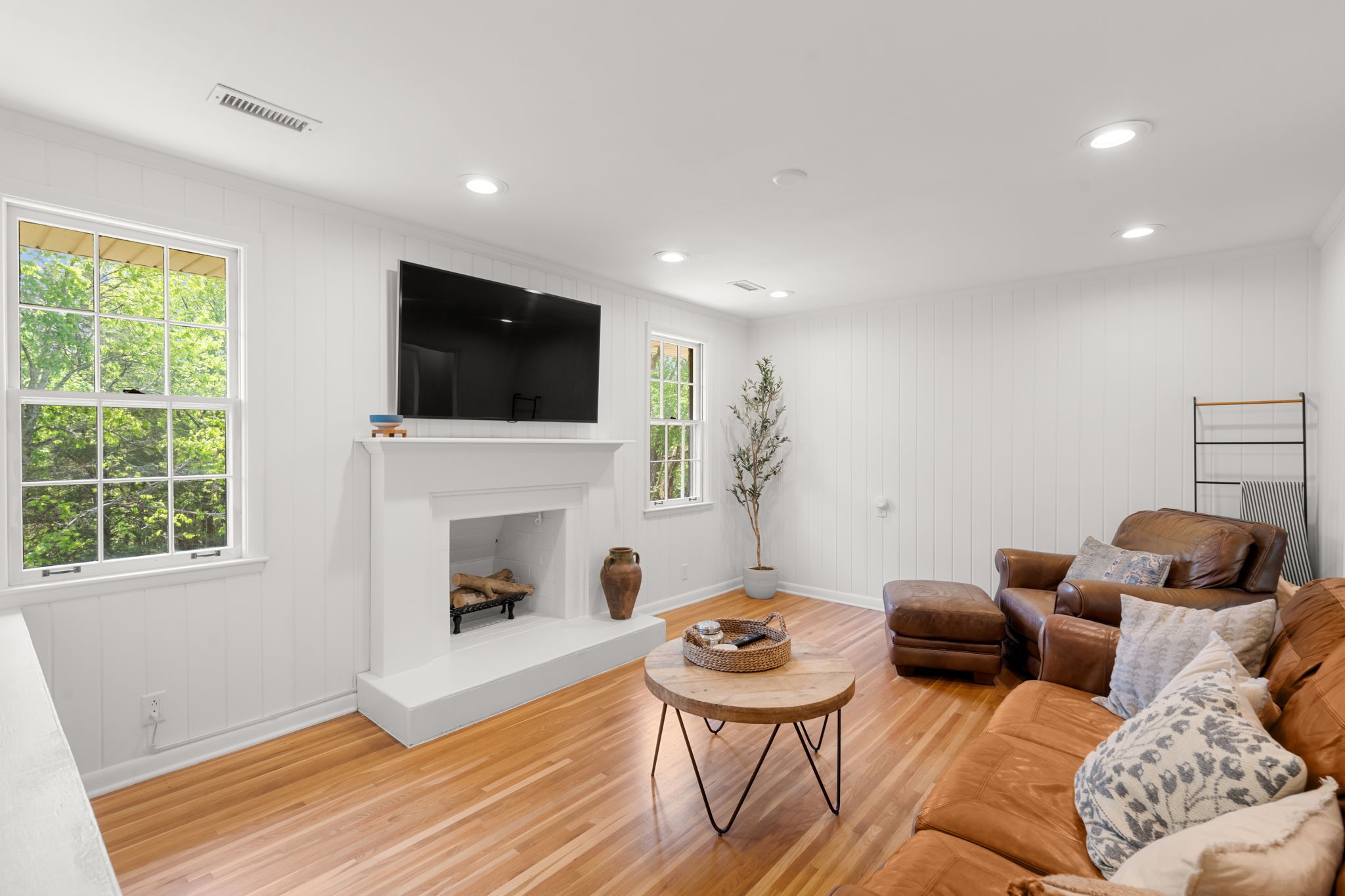 705 Vanoke Drive Madison, TN 37115 - Photo 7 of 40 a living room with furniture a fireplace and a flat screen tv
