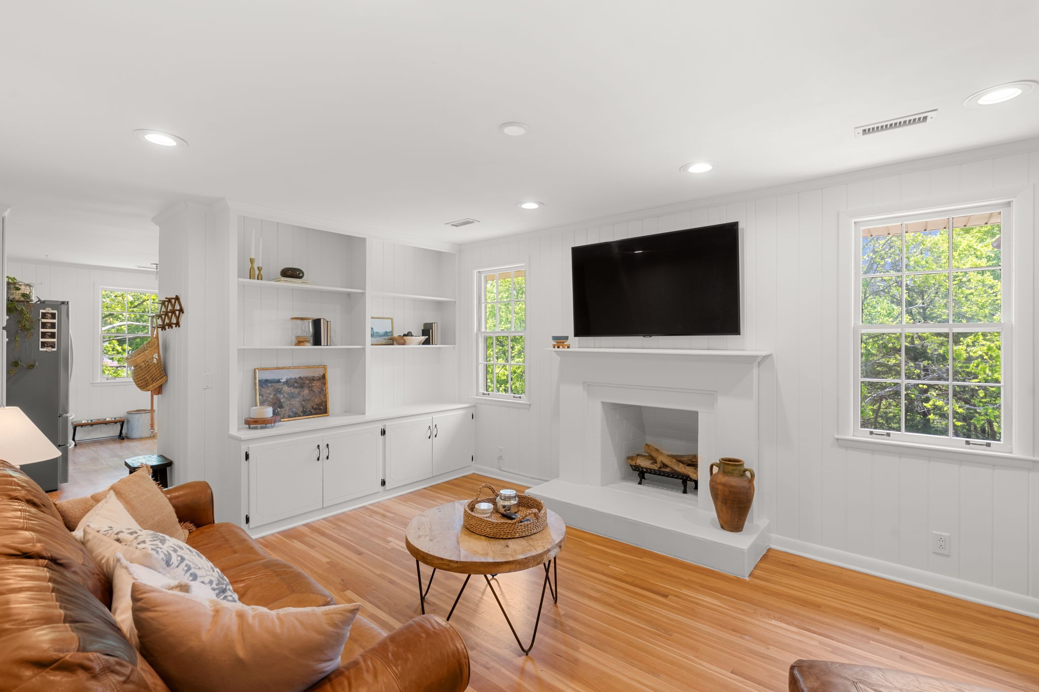 705 Vanoke Drive Madison, TN 37115 - Photo 8 of 40 a living room with furniture a fireplace and a flat screen tv