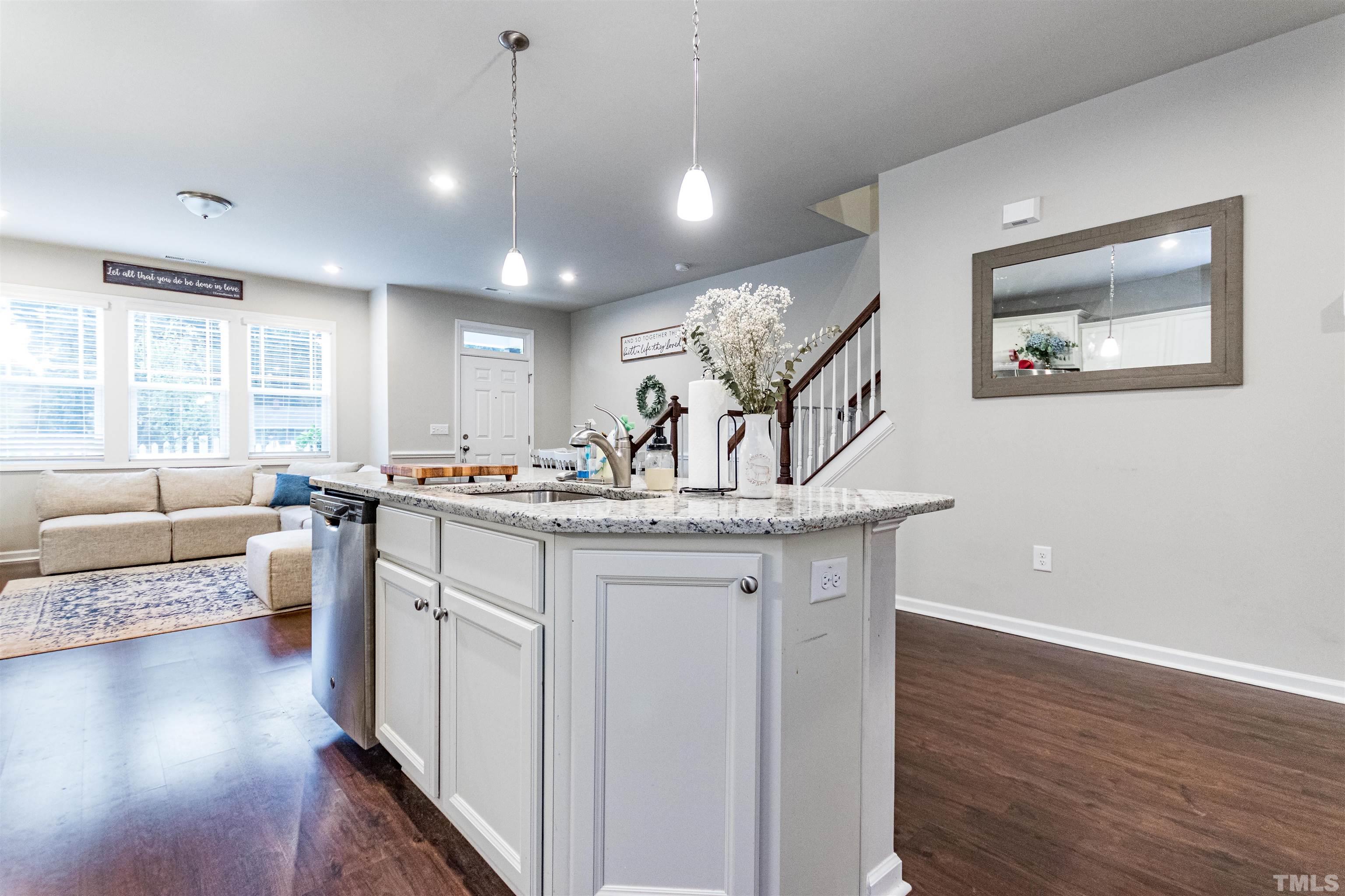 3702 Buffaloe Road Raleigh, NC 27604 - Photo 2 of 13 a kitchen with stainless steel appliances granite countertop a stove and a wooden floors