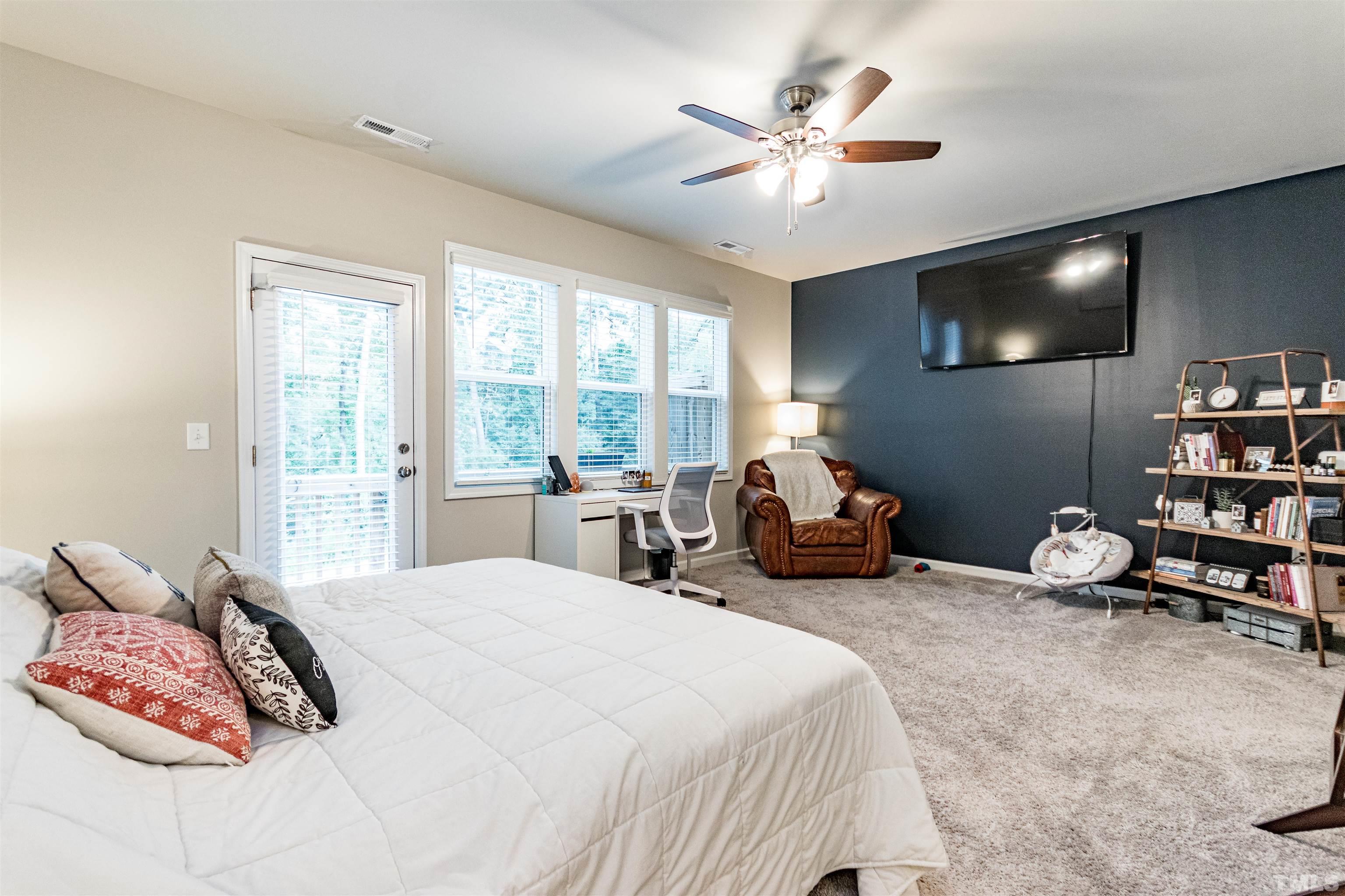 3702 Buffaloe Road Raleigh, NC 27604 - Photo 7 of 13 a bedroom with bed and a large window