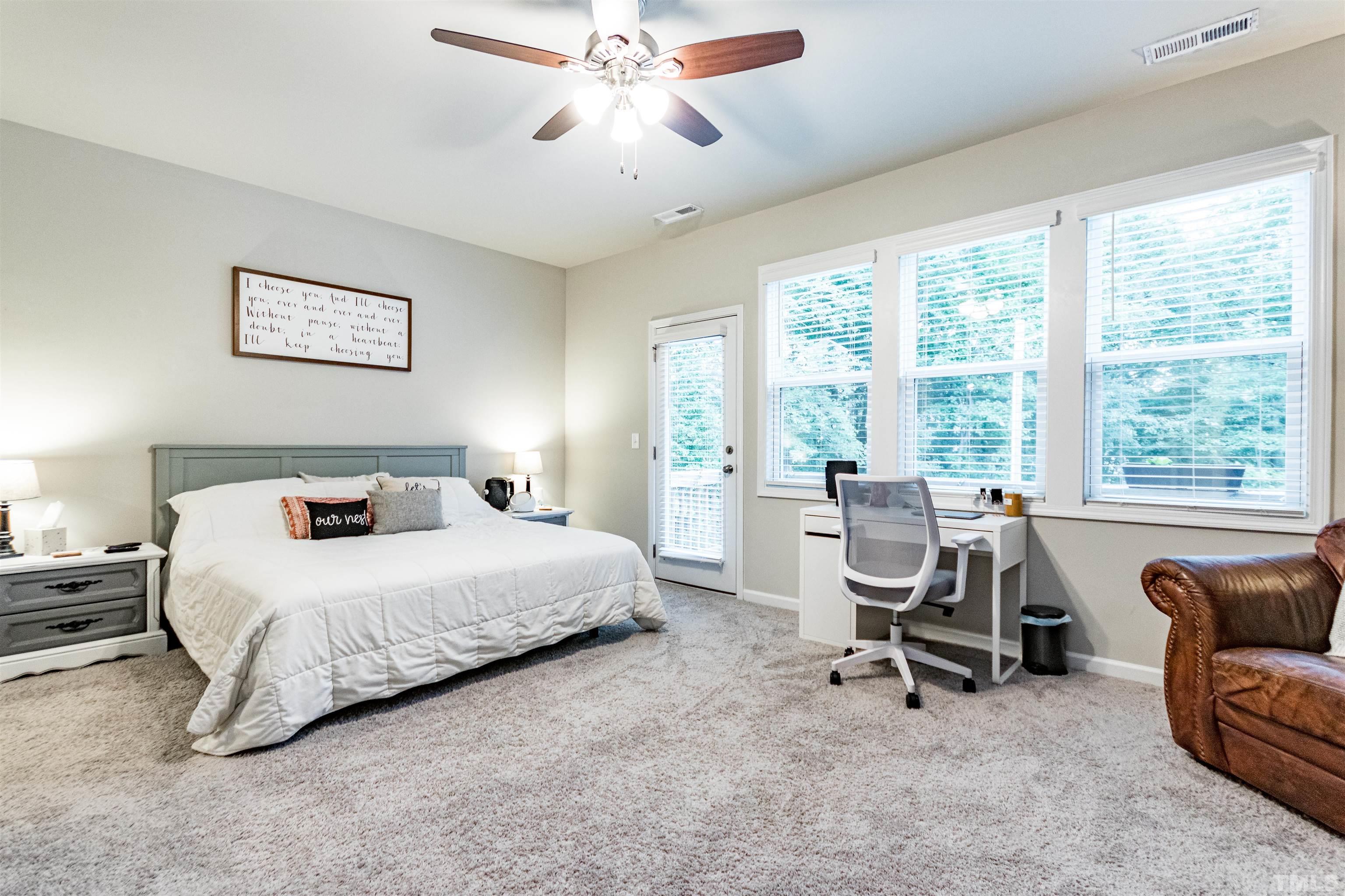 3702 Buffaloe Road Raleigh, NC 27604 - Photo 8 of 13 a bedroom with a bed and a couch