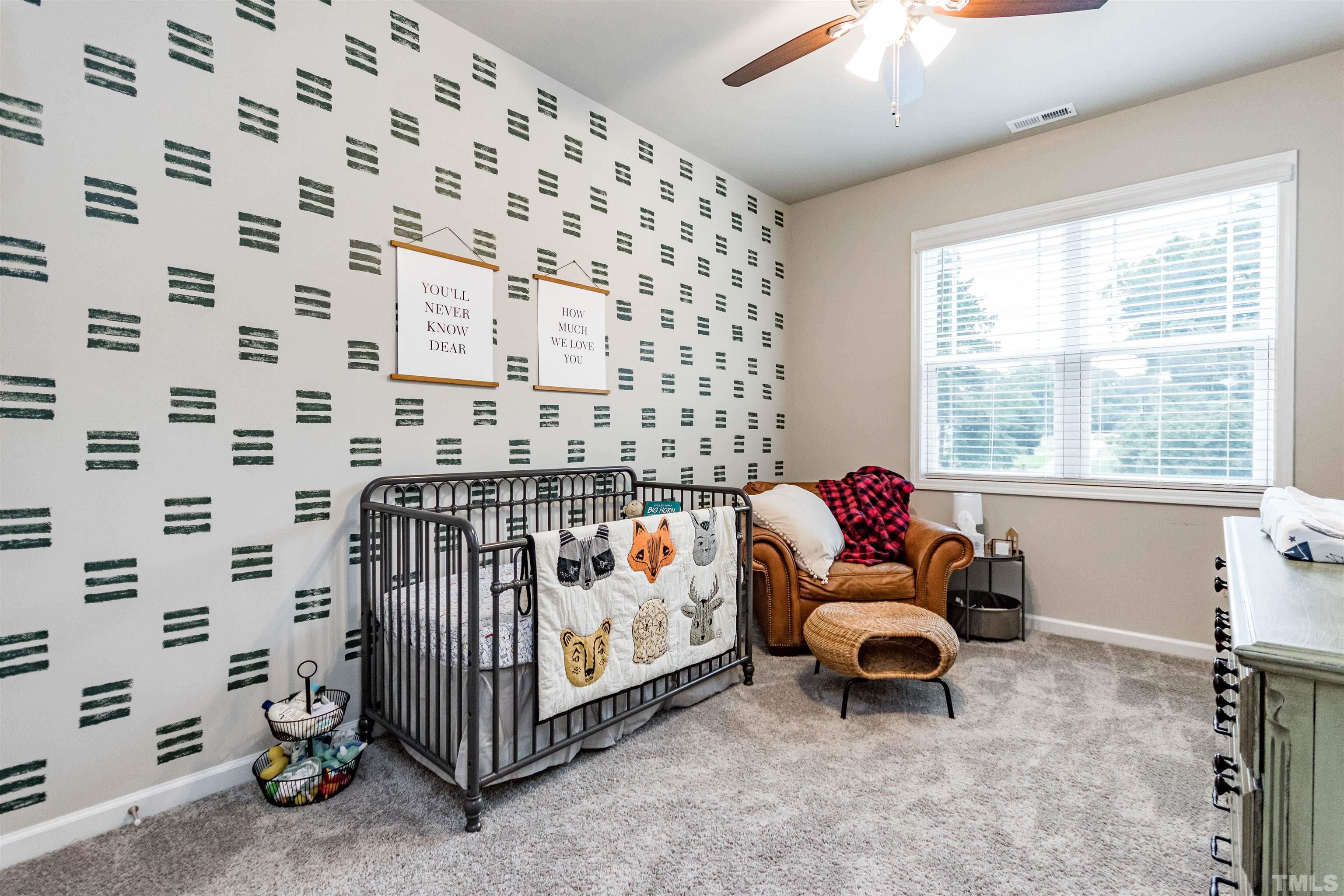 3702 Buffaloe Road Raleigh, NC 27604 - Photo 10 of 13 a bedroom with furniture and a window