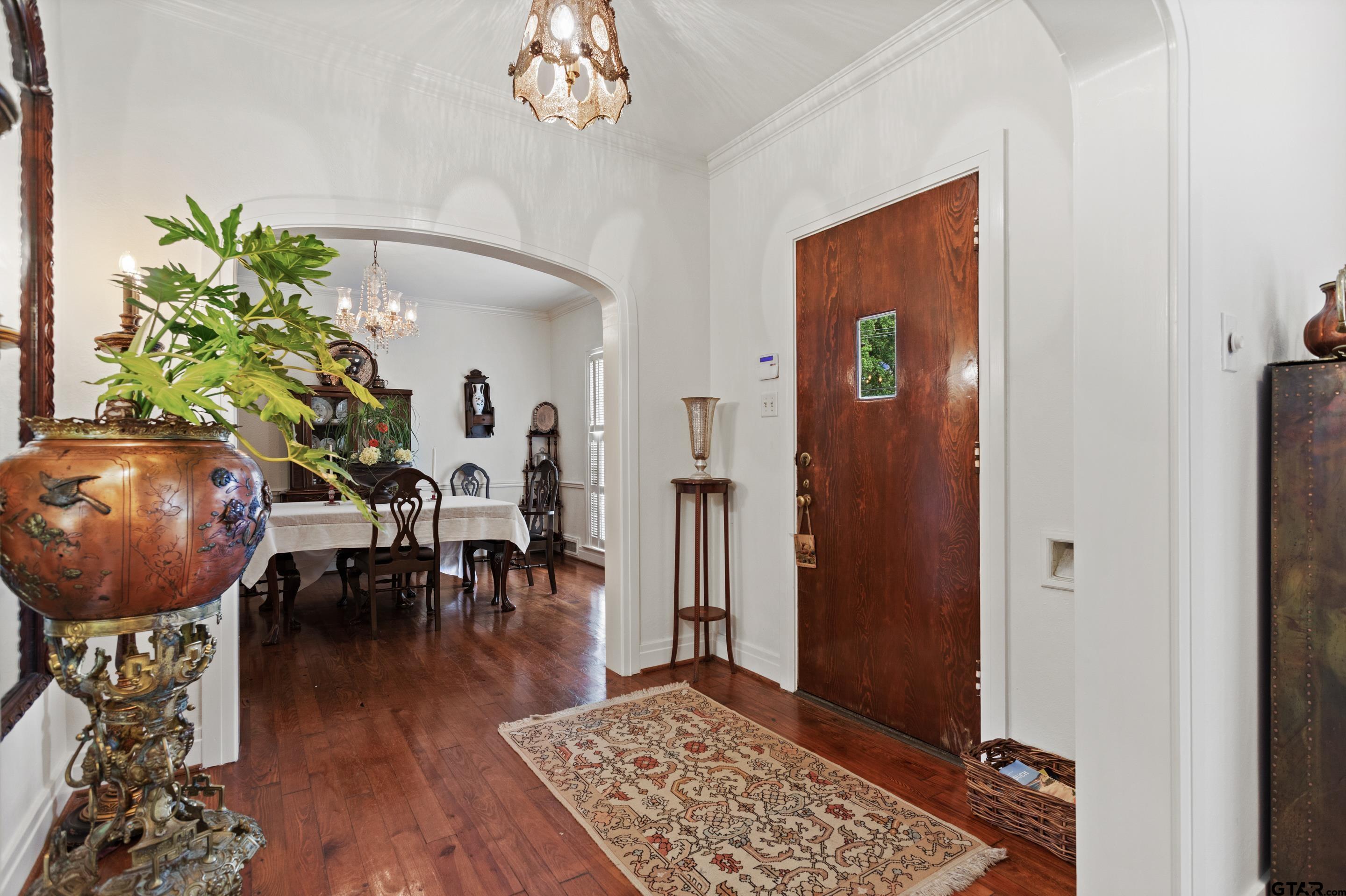 2631 Old Bullard Road Tyler, TX 75701 - Photo 5 of 43 a living room with furniture and a chandelier
