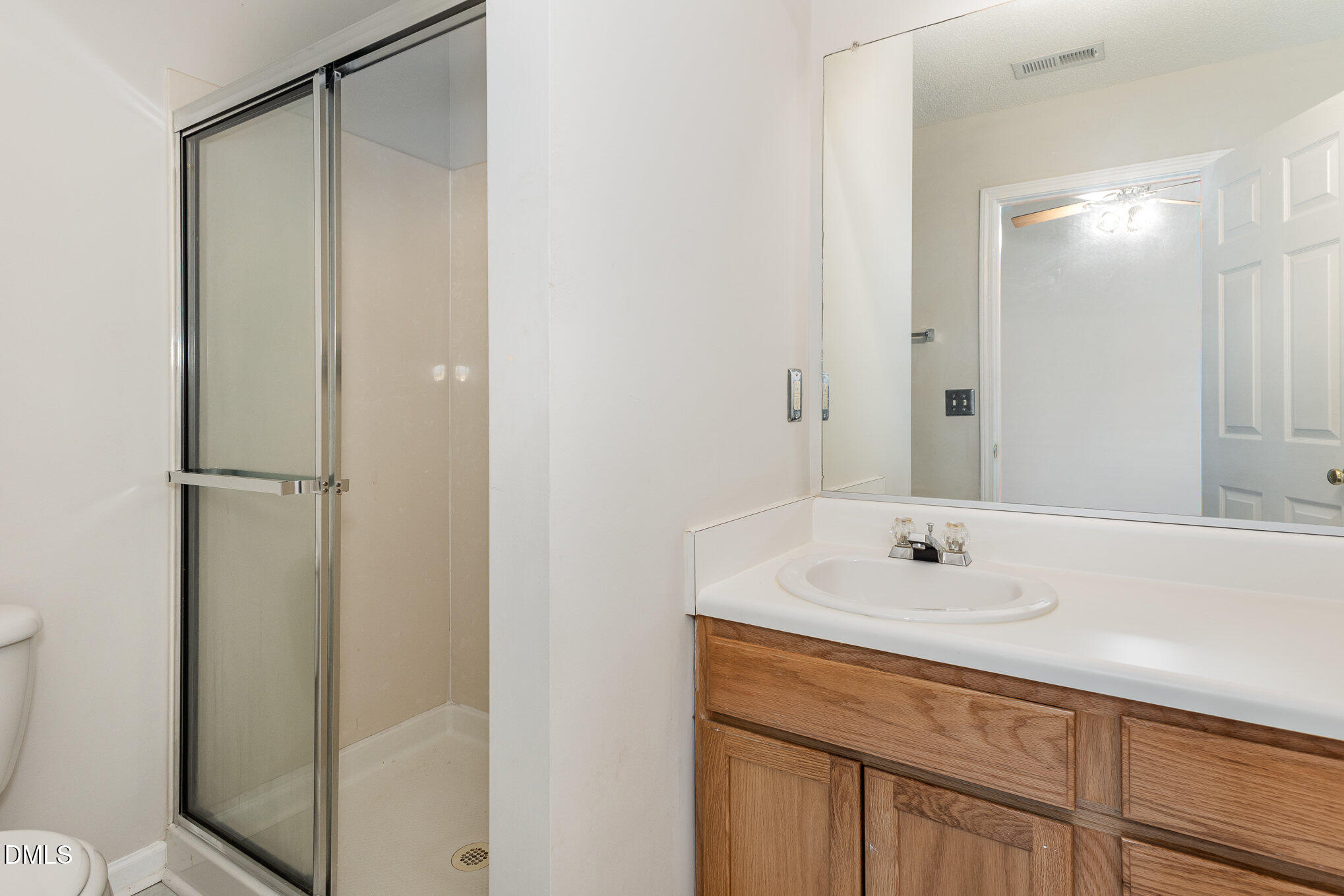 10947 Pendragon Place Raleigh, NC 27614 - Photo 15 of 21 a bathroom with a sink and a mirror