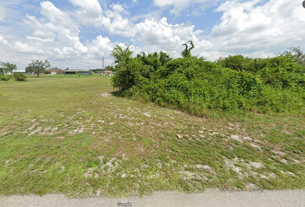 30102 Red Pine Road Punta Gorda, FL 33982 - Photo 2 of 8 a view of a field with an ocean