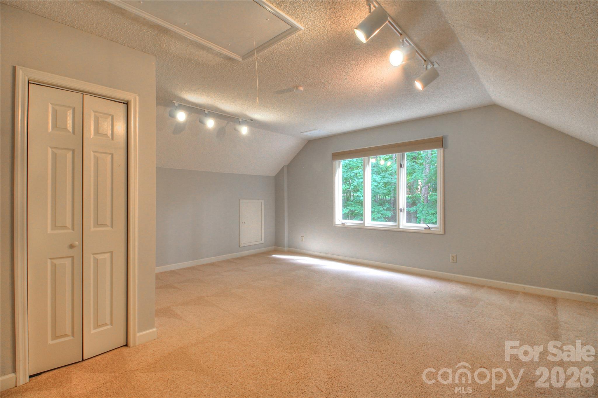 3408 Providence Manor Road Charlotte, NC 28270 - Photo 34 of 39 an empty room with windows and closet