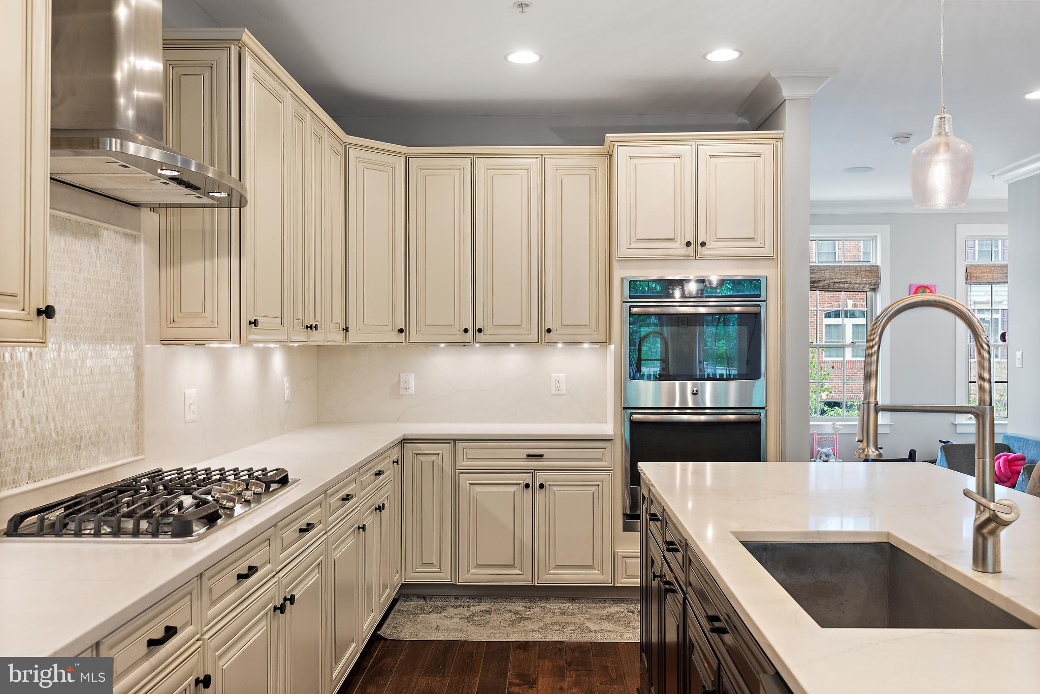 138 Merrimack Way Arnold, MD 21012 - Photo 11 of 50 a kitchen with white cabinets and appliances