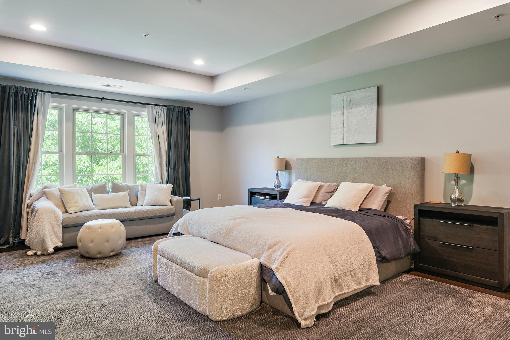 138 Merrimack Way Arnold, MD 21012 - Photo 18 of 50 a spacious bedroom with a bed and a couch