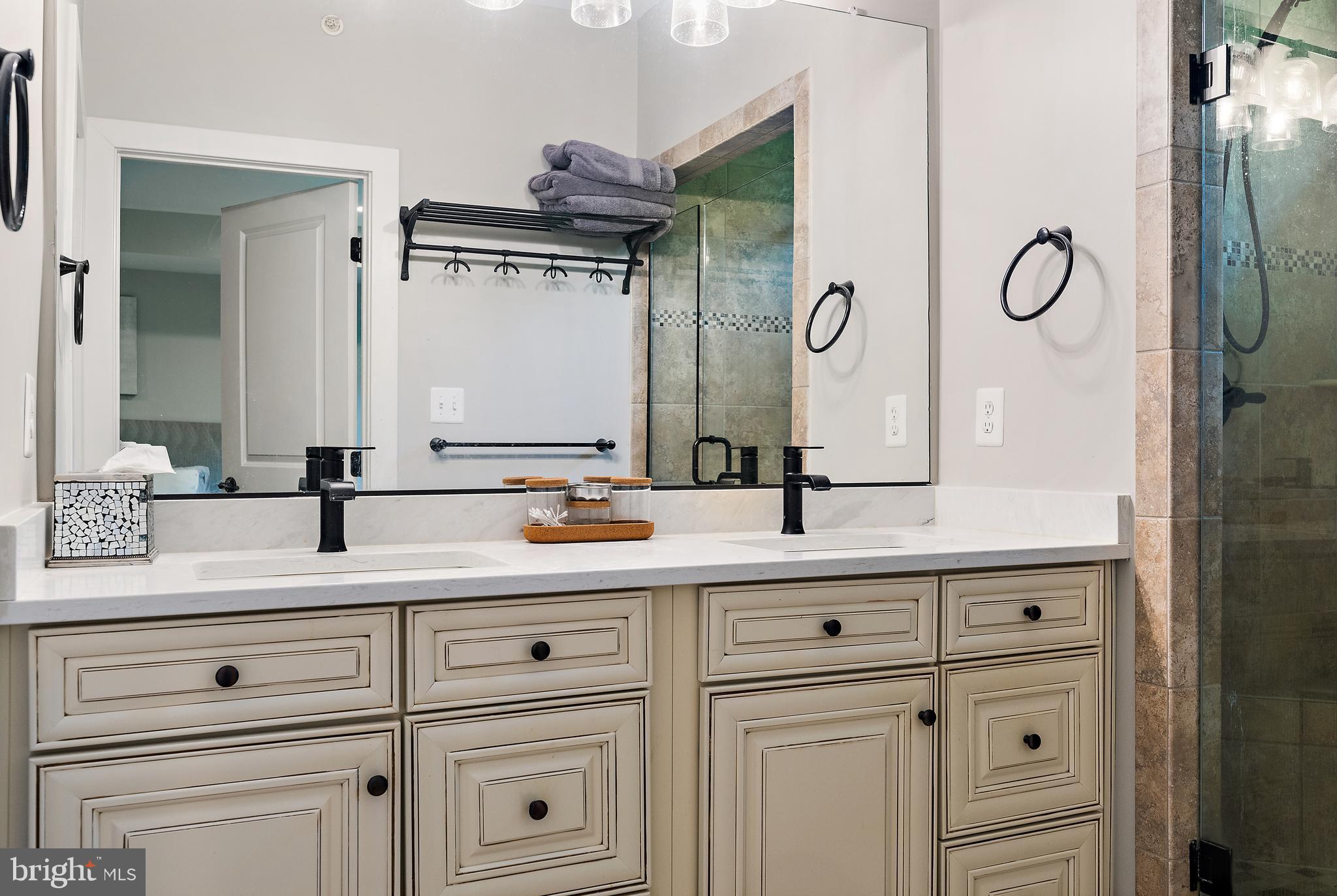 138 Merrimack Way Arnold, MD 21012 - Photo 22 of 50 a bathroom with a double vanity sink and mirror