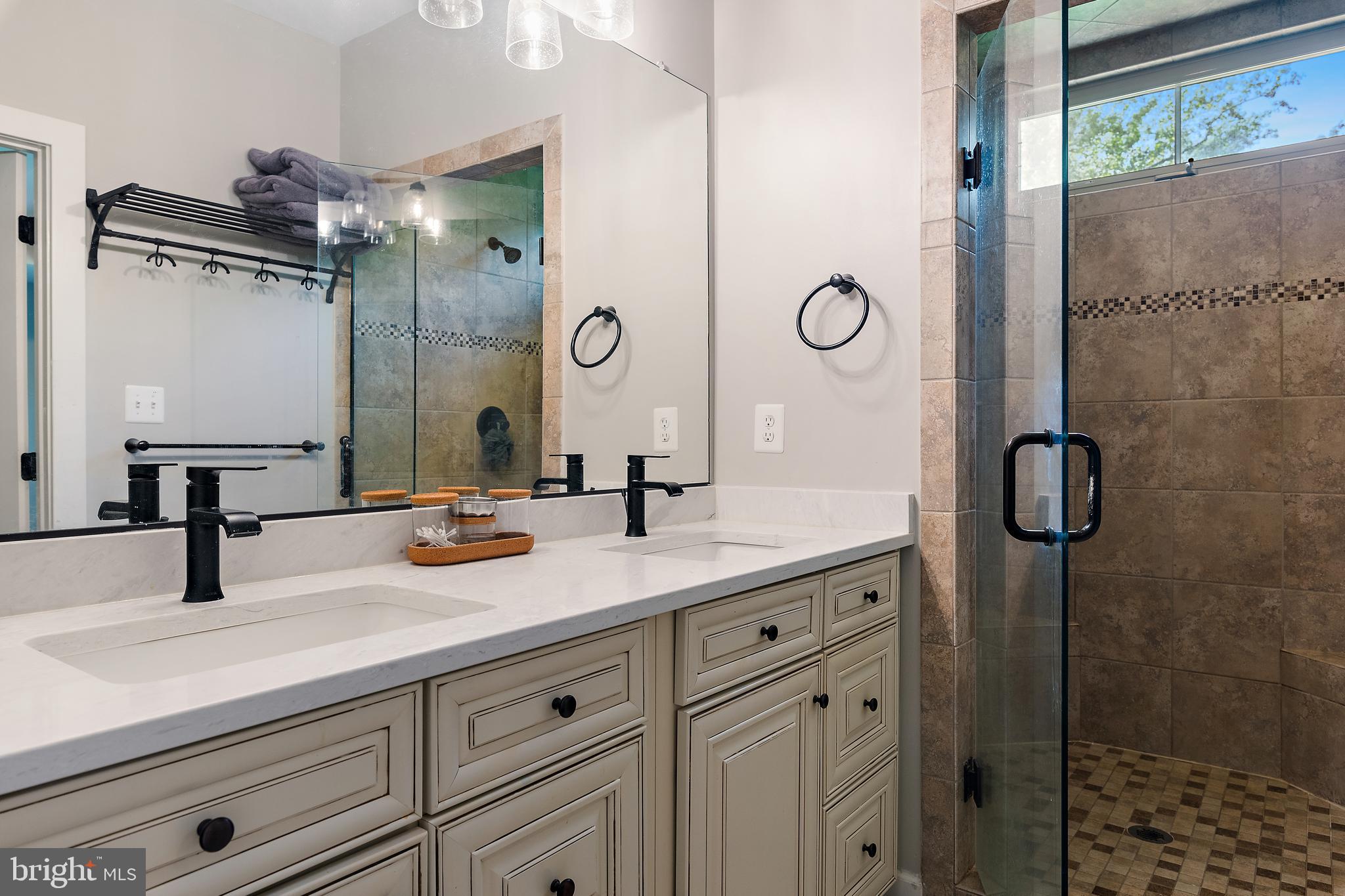 138 Merrimack Way Arnold, MD 21012 - Photo 23 of 50 a bathroom with a granite countertop sink a mirror a vanity and shower