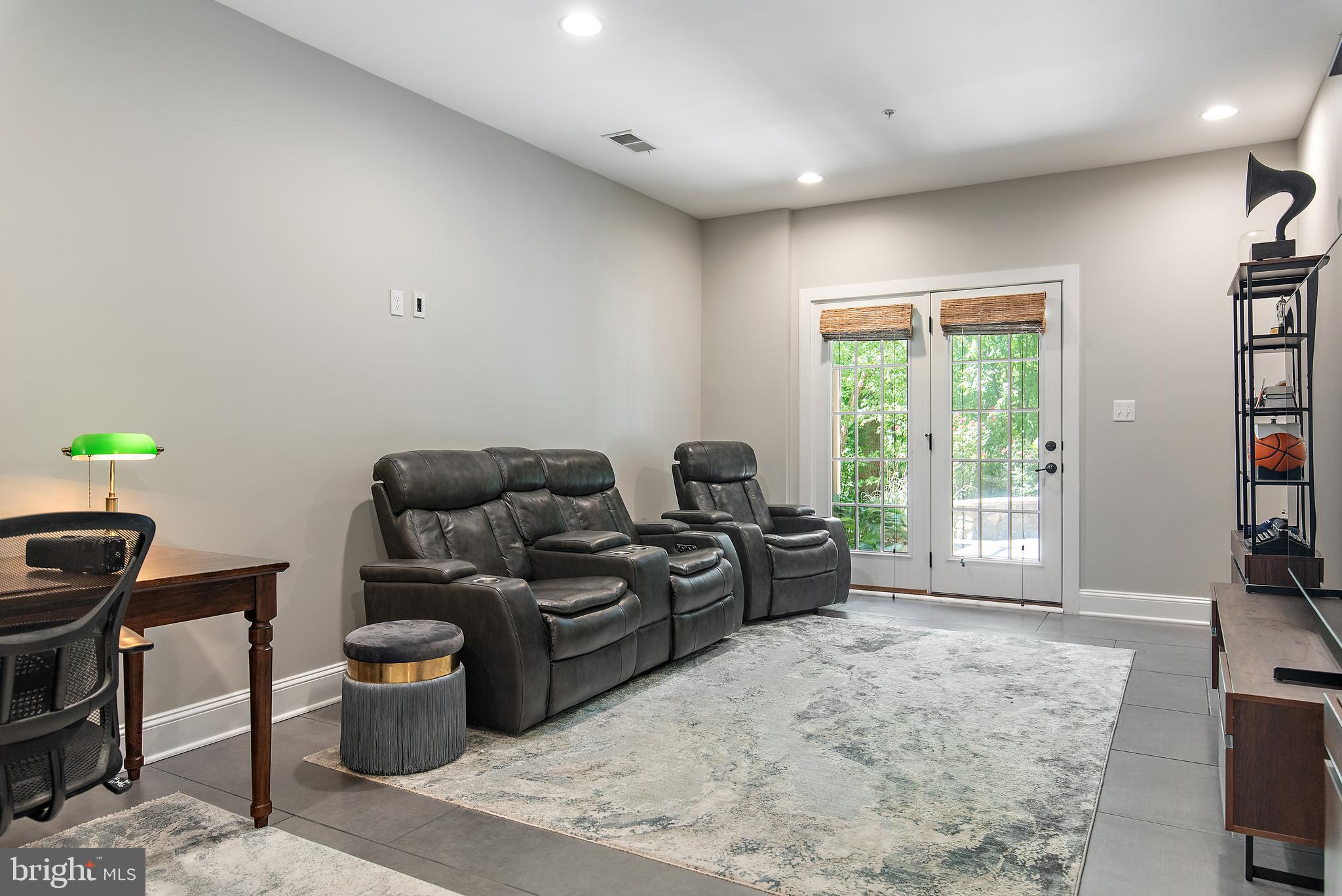 138 Merrimack Way Arnold, MD 21012 - Photo 30 of 50 a living room with furniture a flat screen tv and a large window