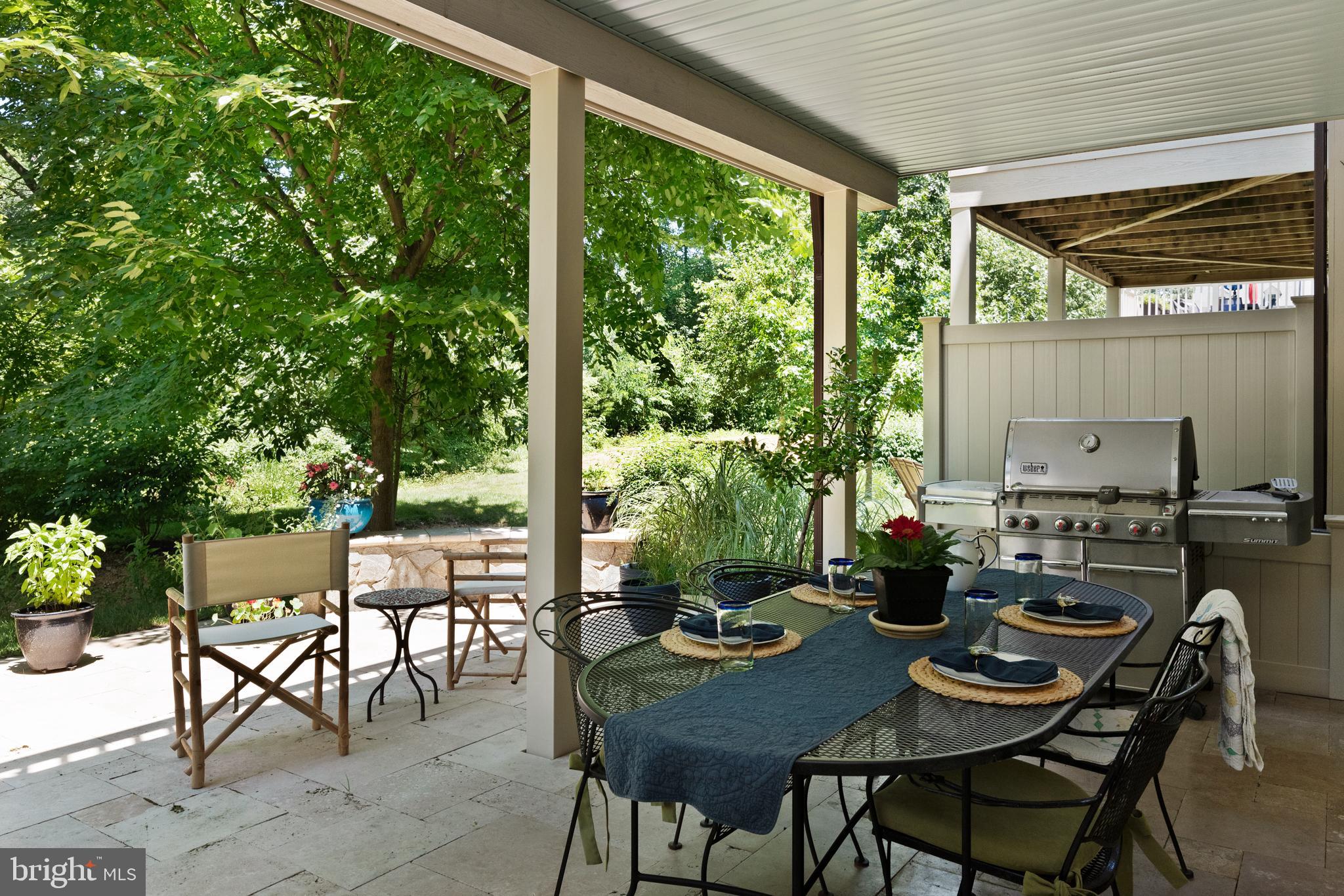 138 Merrimack Way Arnold, MD 21012 - Photo 49 of 50 a view of a patio with a dining table and chairs