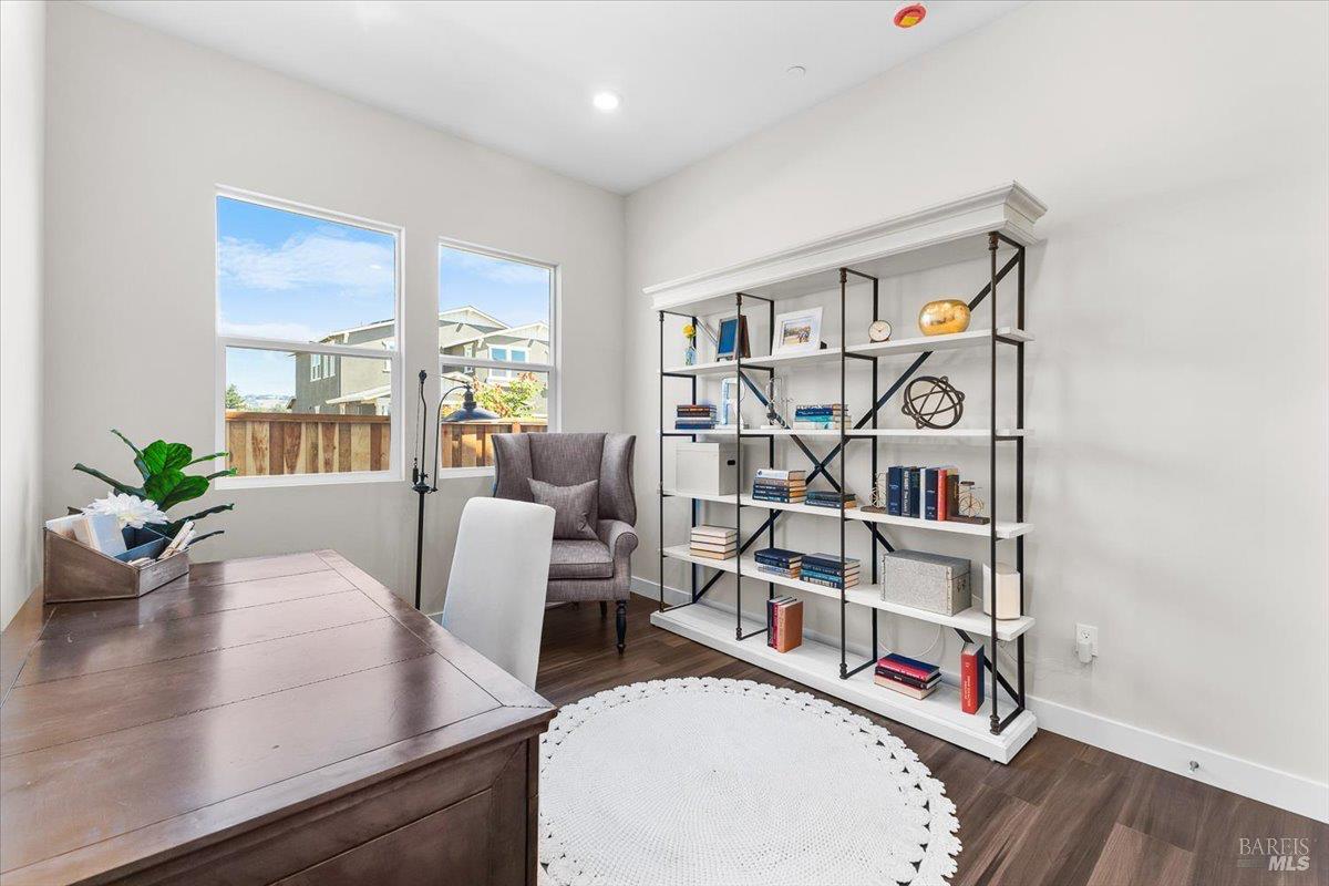 7301 Willowglen Drive Rohnert Park, CA 94928 - Photo 16 of 32 a living room with furniture a rug and white walls