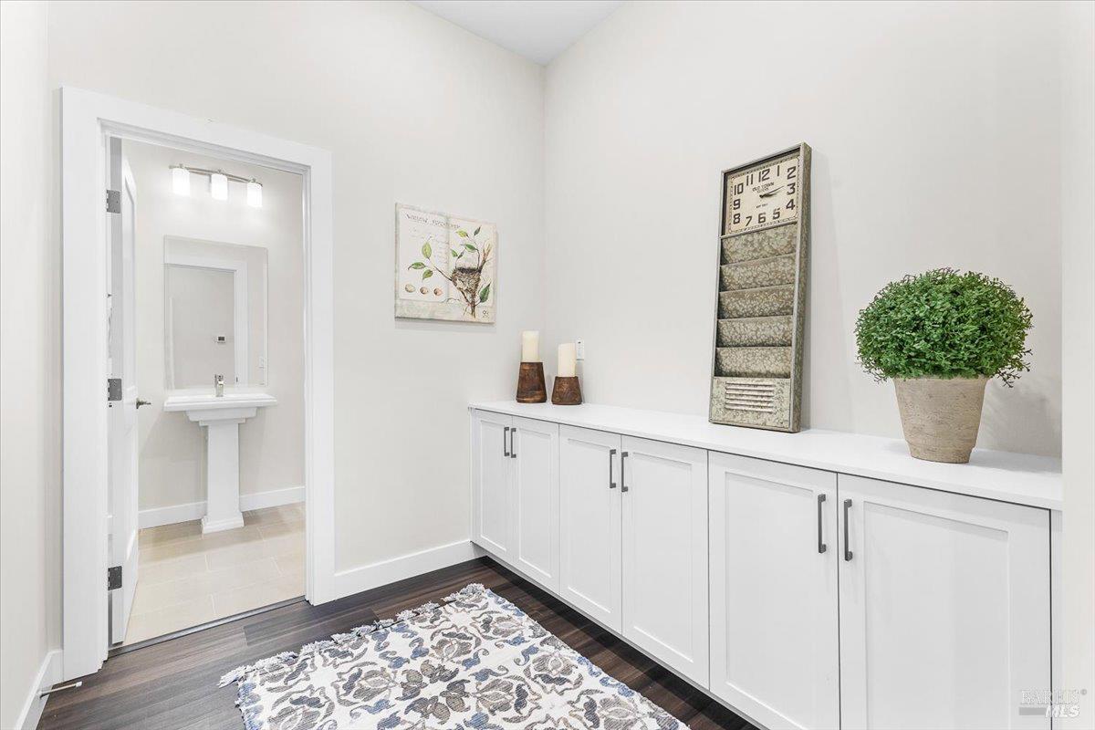 7301 Willowglen Drive Rohnert Park, CA 94928 - Photo 17 of 32 a view of a hallway with cabinet and a potted plant