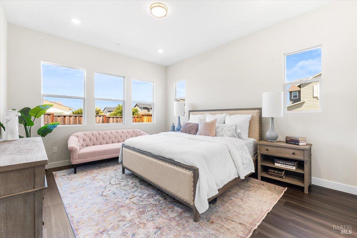 7301 Willowglen Drive Rohnert Park, CA 94928 - Photo 19 of 32 a bedroom with a bed a couch and window