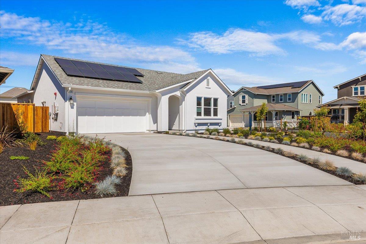 7301 Willowglen Drive Rohnert Park, CA 94928 - Photo 2 of 32 a front view of a house with a yard and garage