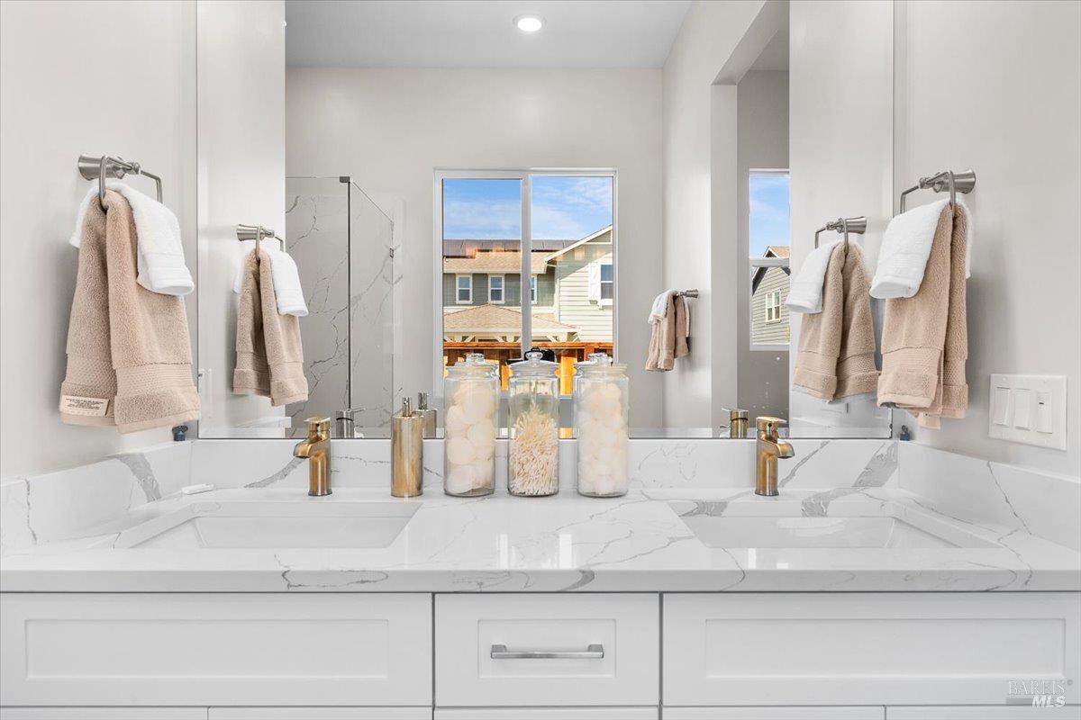 7301 Willowglen Drive Rohnert Park, CA 94928 - Photo 23 of 32 a bathroom with double vanity sink and mirror