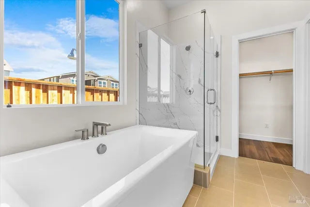 a bathroom with a tub and a sink