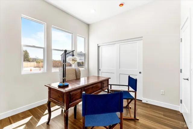 a backyard of a house with table and chairs