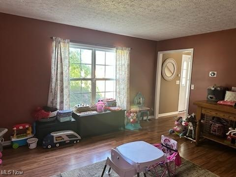 2761 Omega Road Greenwich, OH 44837 - Photo 21 of 50 Sitting room featuring a textured ceiling and dark hardwood / wood-style flooring
