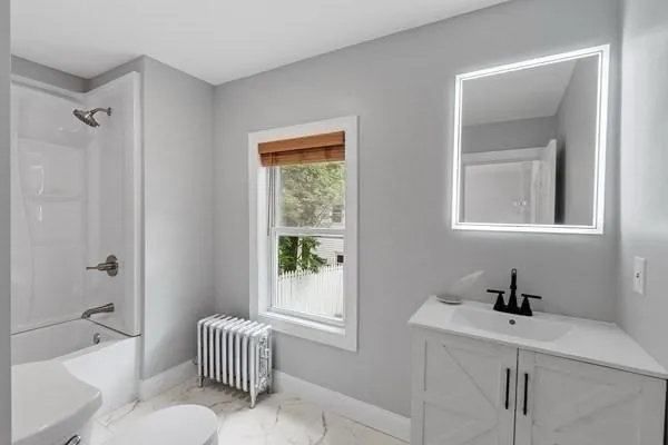 a room with a window and a chair