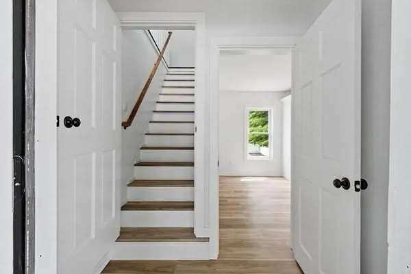 a view of entryway with wooden floor