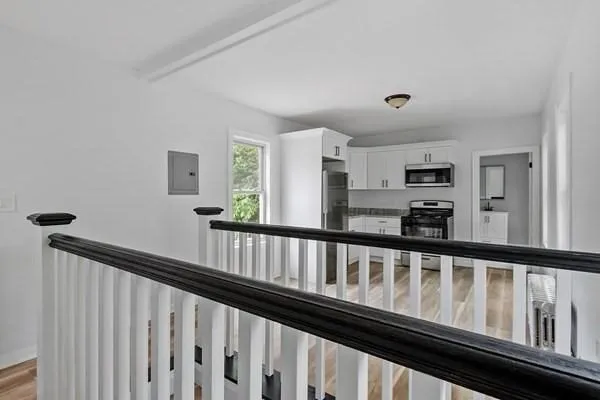 a view of wooden floor and windows