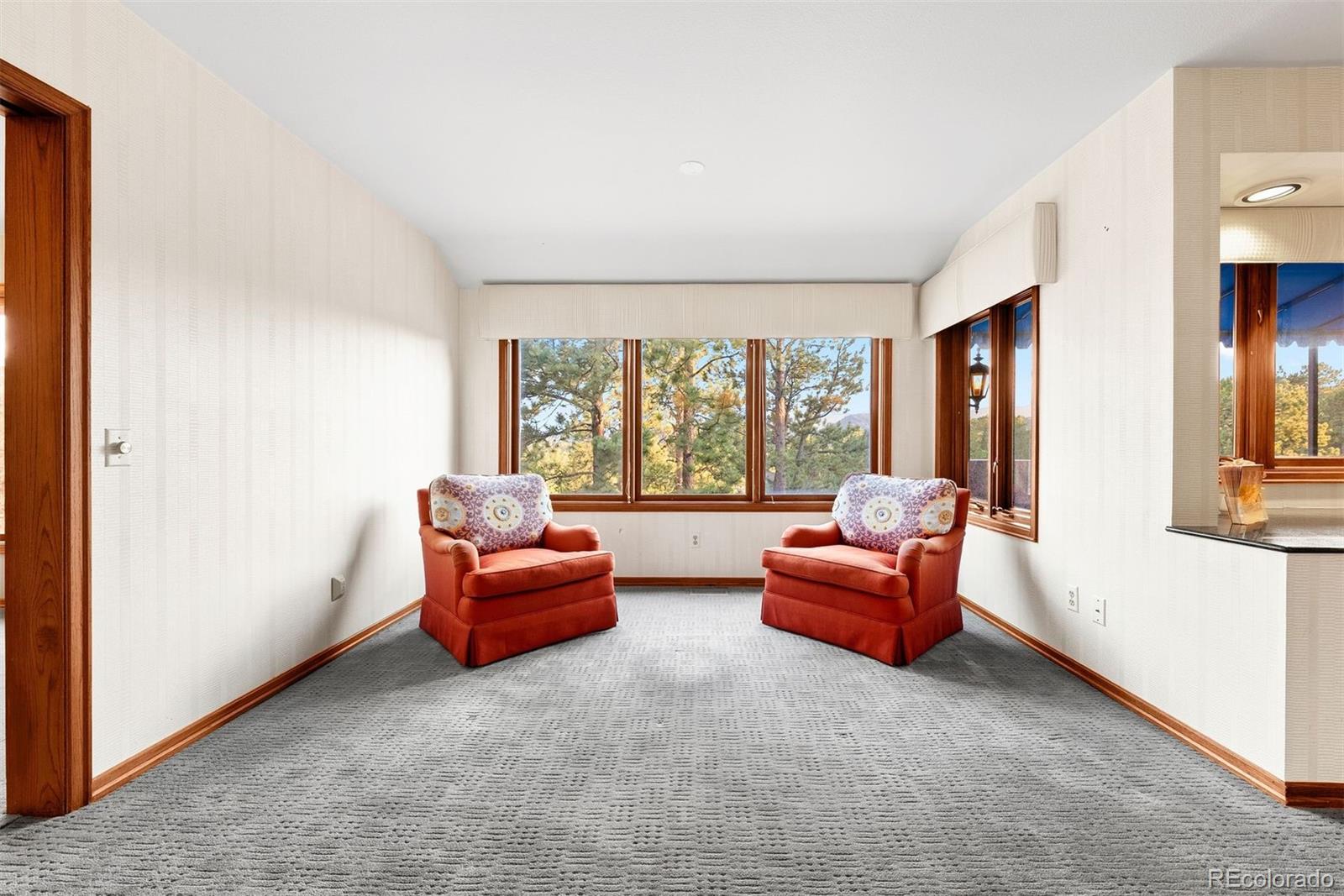 2851 Interlocken Drive Evergreen, CO 80439 - Photo 18 of 50 a living room with furniture and a large window